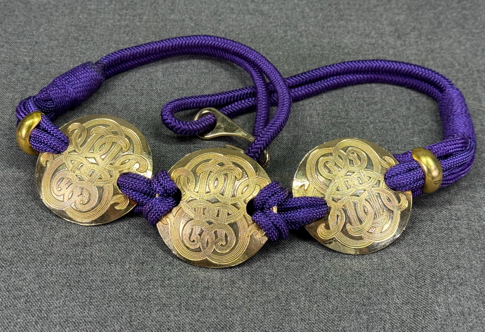 Vintage 1980s Boho Purple Braided Rope Belt w/ Gold-tone Scroll Medallions. *L: Vintage 1980s Boho Purple Braided Rope Belt w/ Gold-tone Scroll Medallions. Unmarked. For measures please refer to the pictures taken with a measuring tape. Weight: 100 Grams. IN HOUSE FLAT SHIPPING &