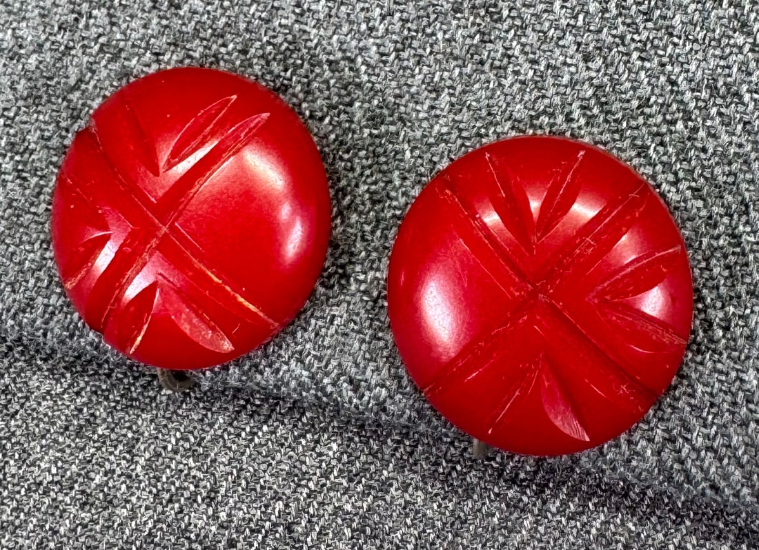 Vintage carved red bakelite screw back earrings
