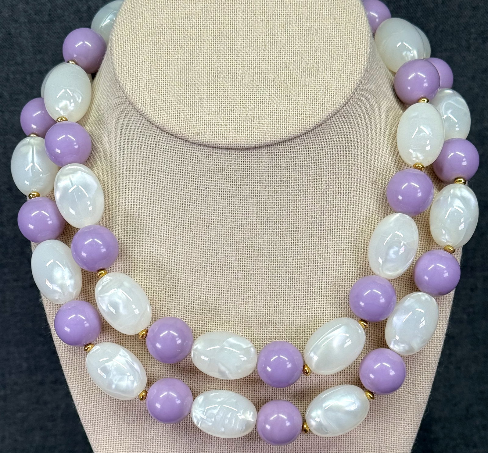 Vintage Monet lilac, pearly white plastic & gold-toned beaded necklace. *c: Vintage Monet lilac, pearly white plastic & gold-toned beaded necklace. Marked. For measures please refer to the pictures taken with a measuring tape. Weight: 125 Grams. IN HOUSE FLAT SHIPPING & HANDL