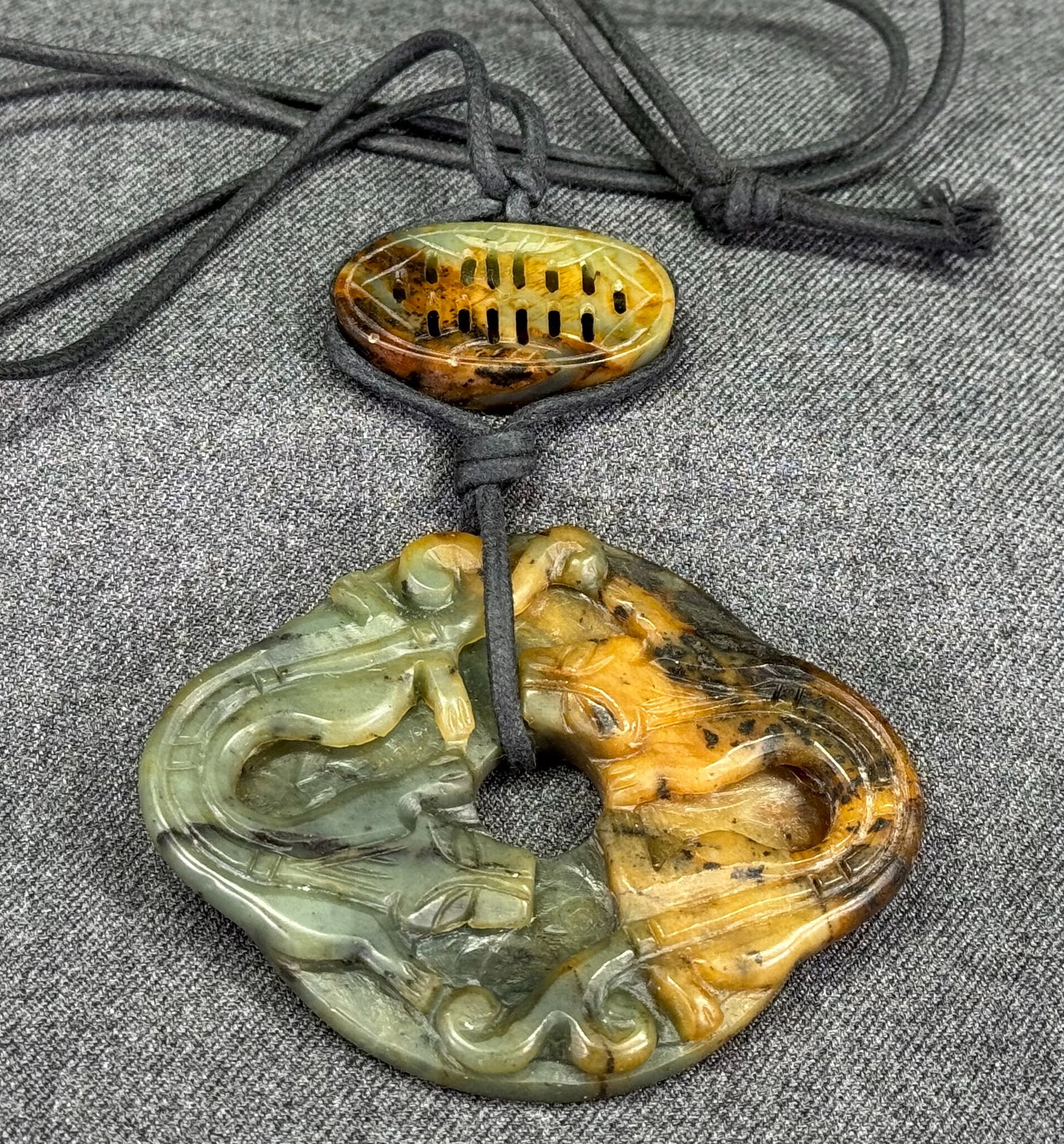 Vintage Chinese carved jade lotus seed and two dragons medallion necklace. 3 inches wide