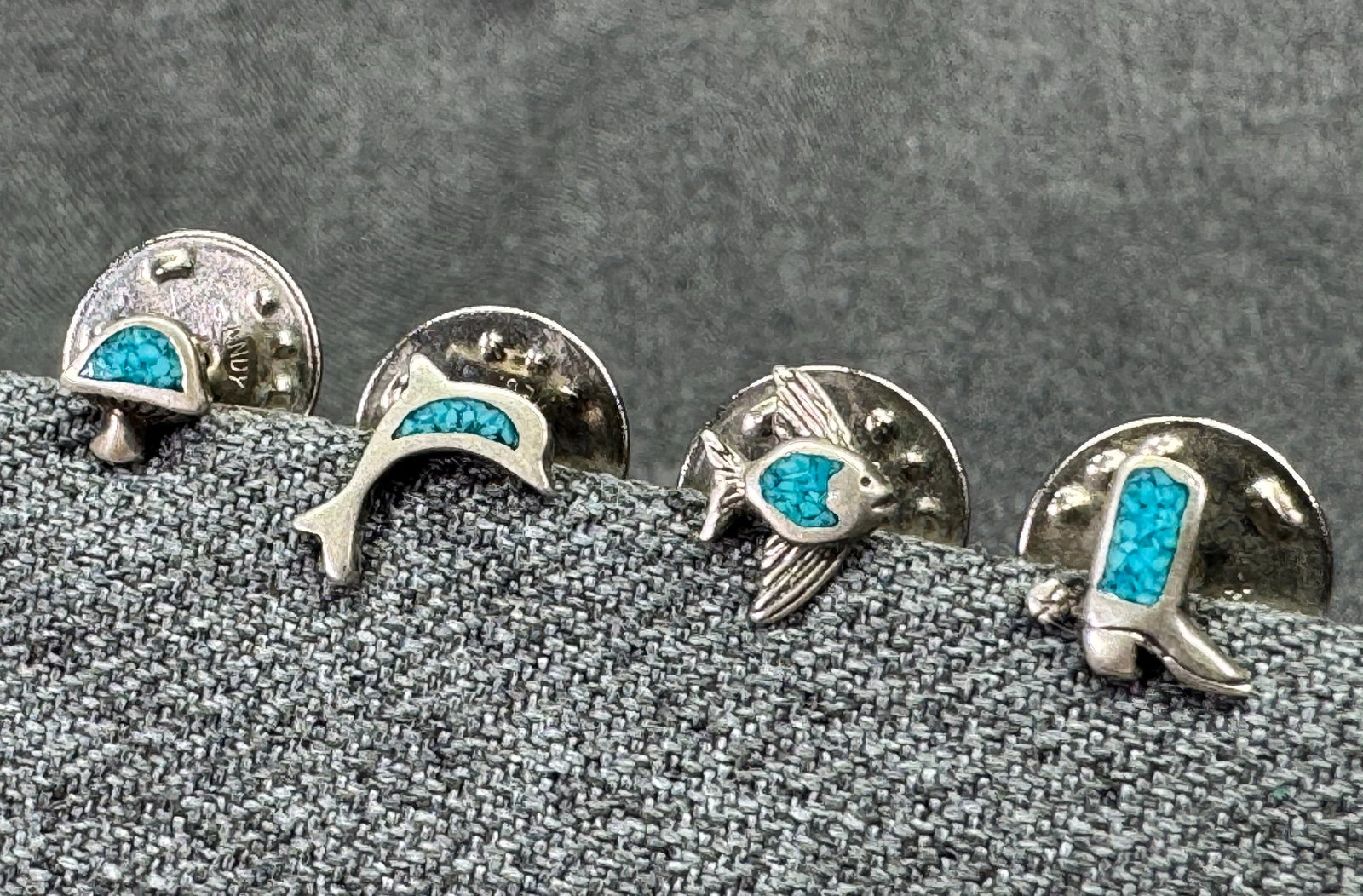 Vintage Southwestern sterling silver turquoise inlay lapel pins.Cowboy Boot Mushroom Dolphin Fish *i: Vintage Southwestern sterling silver crushed turquoise chip inlay lapel pins. Cowboy Boot, Mushroom, Dolphin & Fish. Unmarked. For measures please refer to the pictures taken with a measuring tape. We
