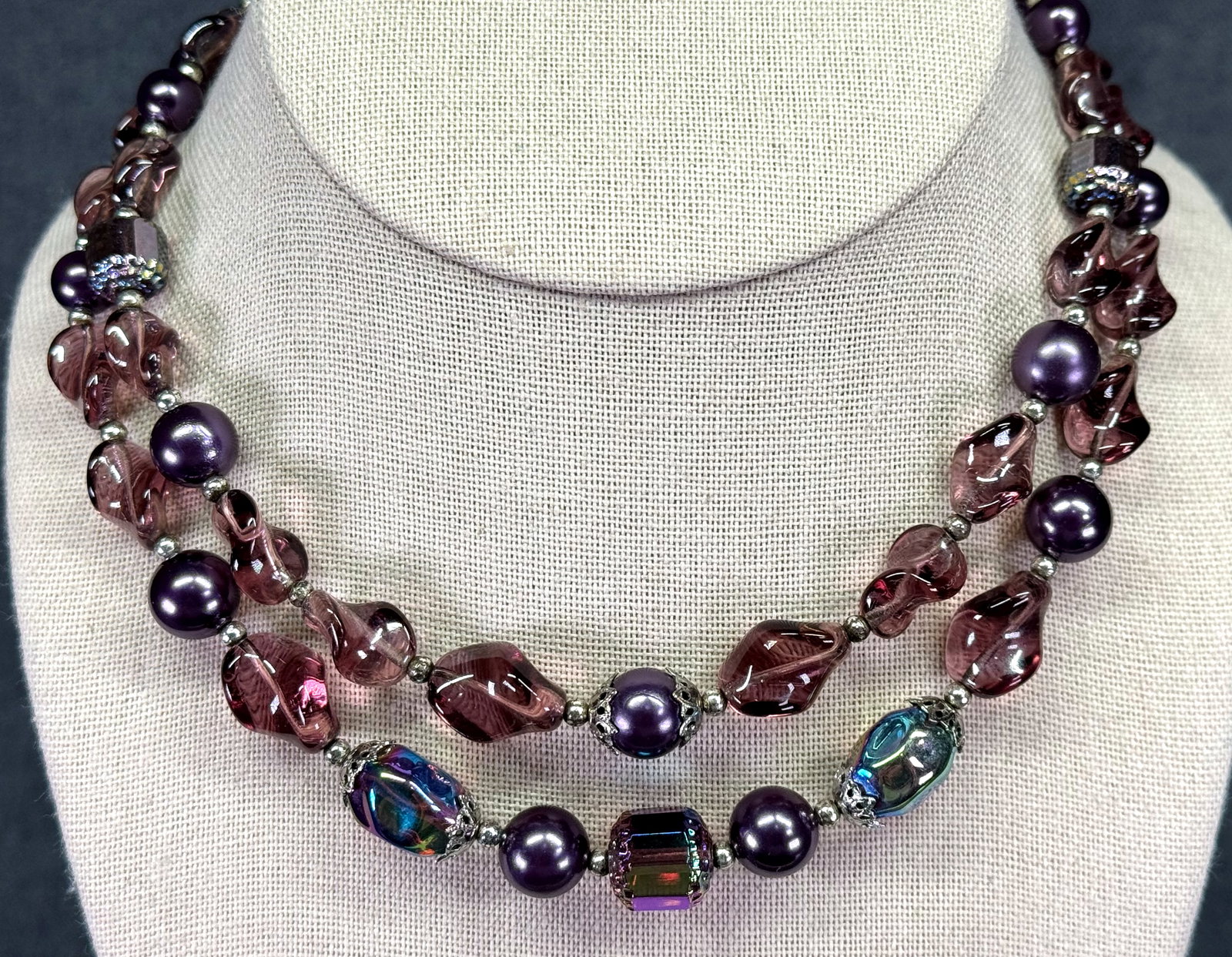 Vintage Trifari Double Strand Purple Beaded Collar Necklace. *i: Vintage Trifari Double Strand Purple Amethyst Beaded Collar Necklace. Glass, faux pearl. Silver-toned. Leaves clasp. Marked. For measures please refer to the pictures taken with a measuring tape. Weig