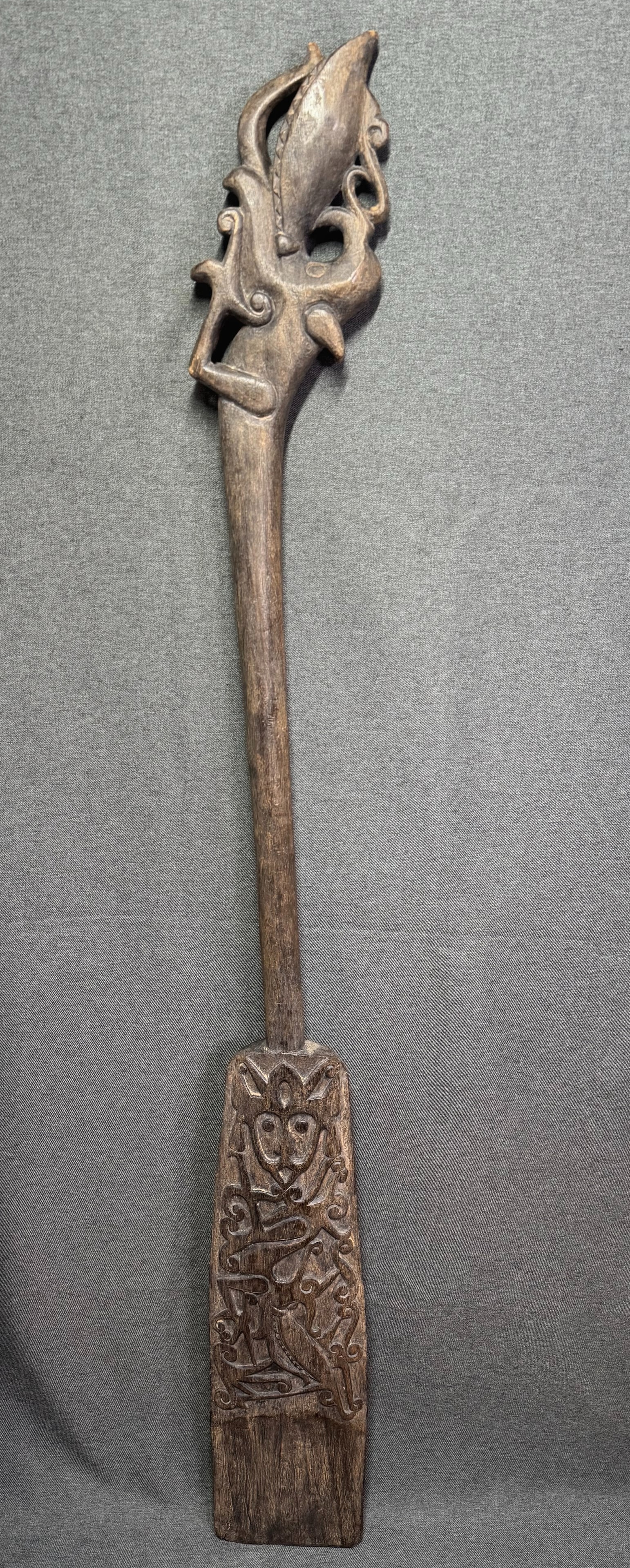 Dayak Borneo Kalimantan Paddle a: Dayak Borneo Kalimantan PaddleCarved wood. It measures 50 inches long and 5 3/4 inches wide. For measures please refer to the pictures taken with a measuring tape. IN HOUSE FLAT SHIPPING & HANDLING CO