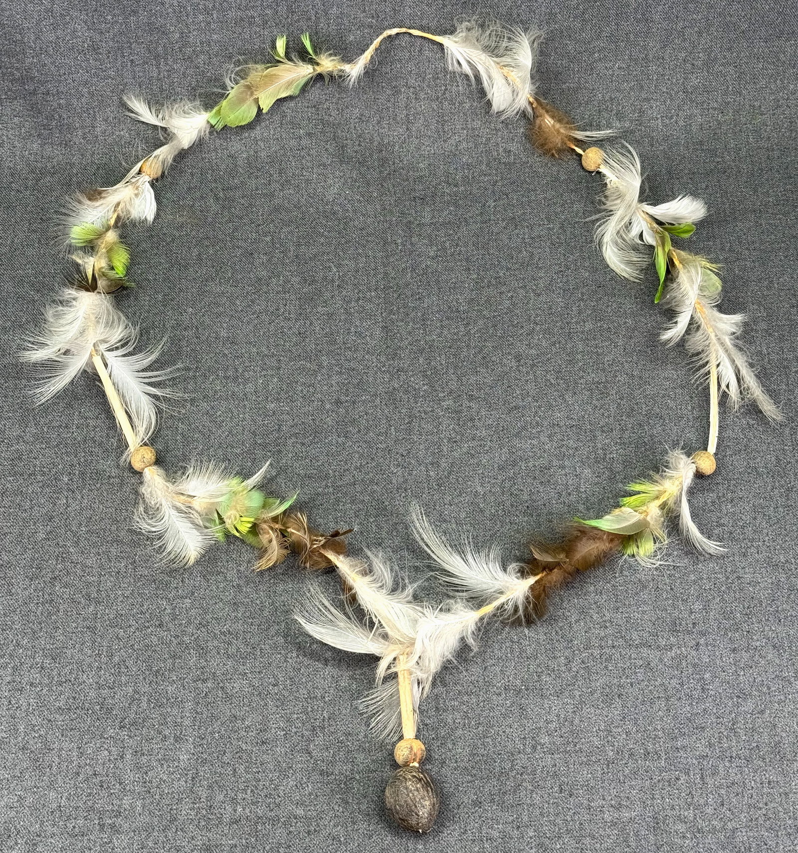 Amazonian Necklace.: Amazonian Necklace. Feathers, bone, seeds, fiber. Ex Collection Dr. Scott James Sandage, Evanston, Illinois. For measures please refer to the pictures that were taken with a measuring tape. IN HOUSE F