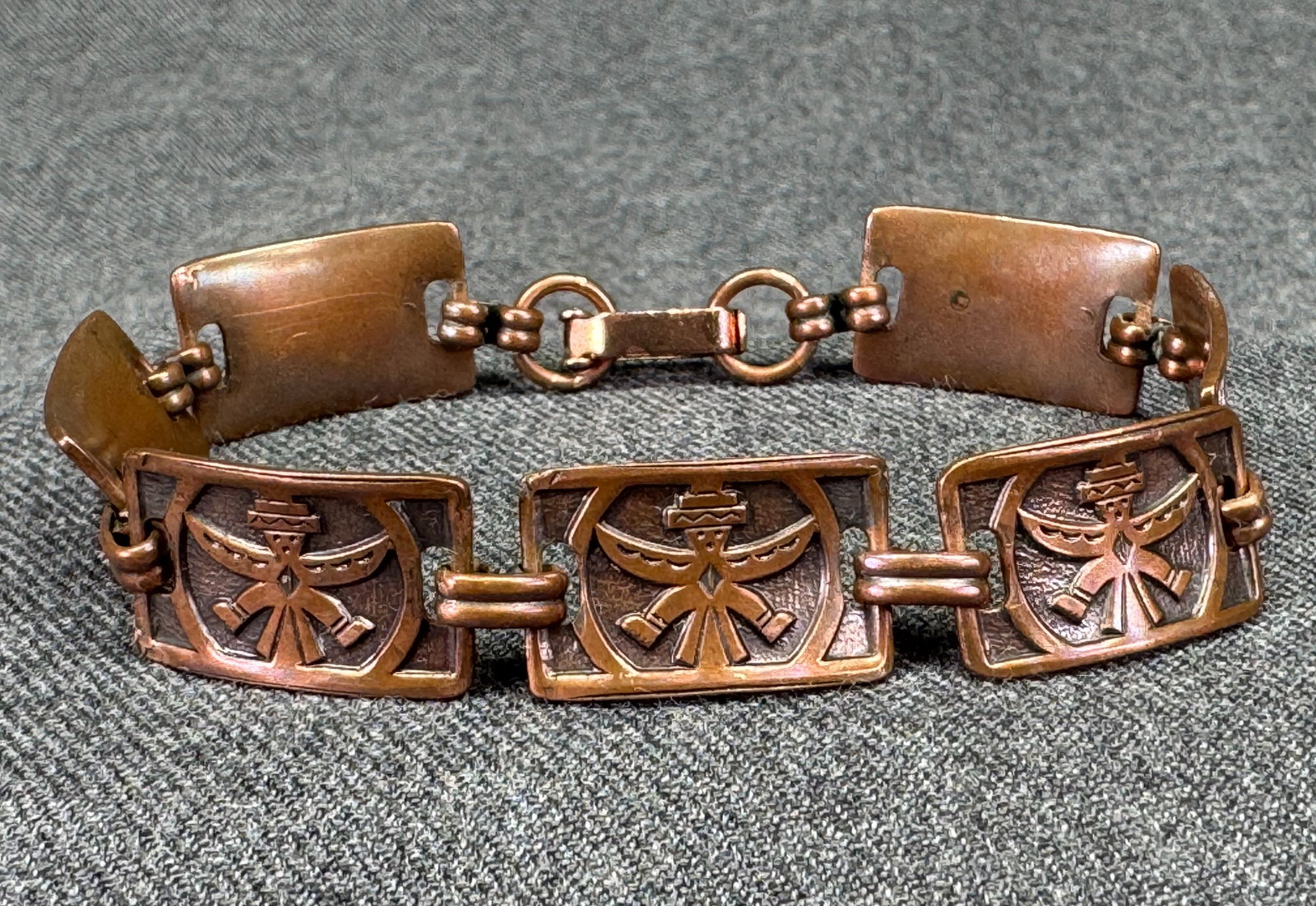 Vintage Southwestern Solid Copper Knifewing Kachina Panel Bracelet. *K: Vintage Southwestern Solid Copper Knifewing Kachina Panel Bracelet. Unmarked. For measures please refer to the pictures taken with a measuring tape. Weight: 18 Grams. IN HOUSE FLAT SHIPPING & HANDLING