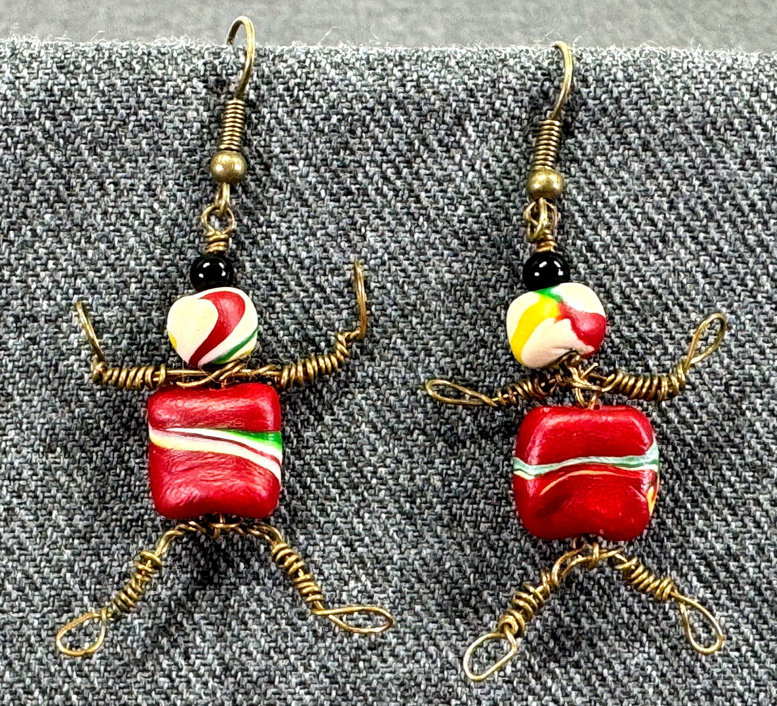 Vintage hand crafted wired man hook earrings. Bronze wire, polymer clay