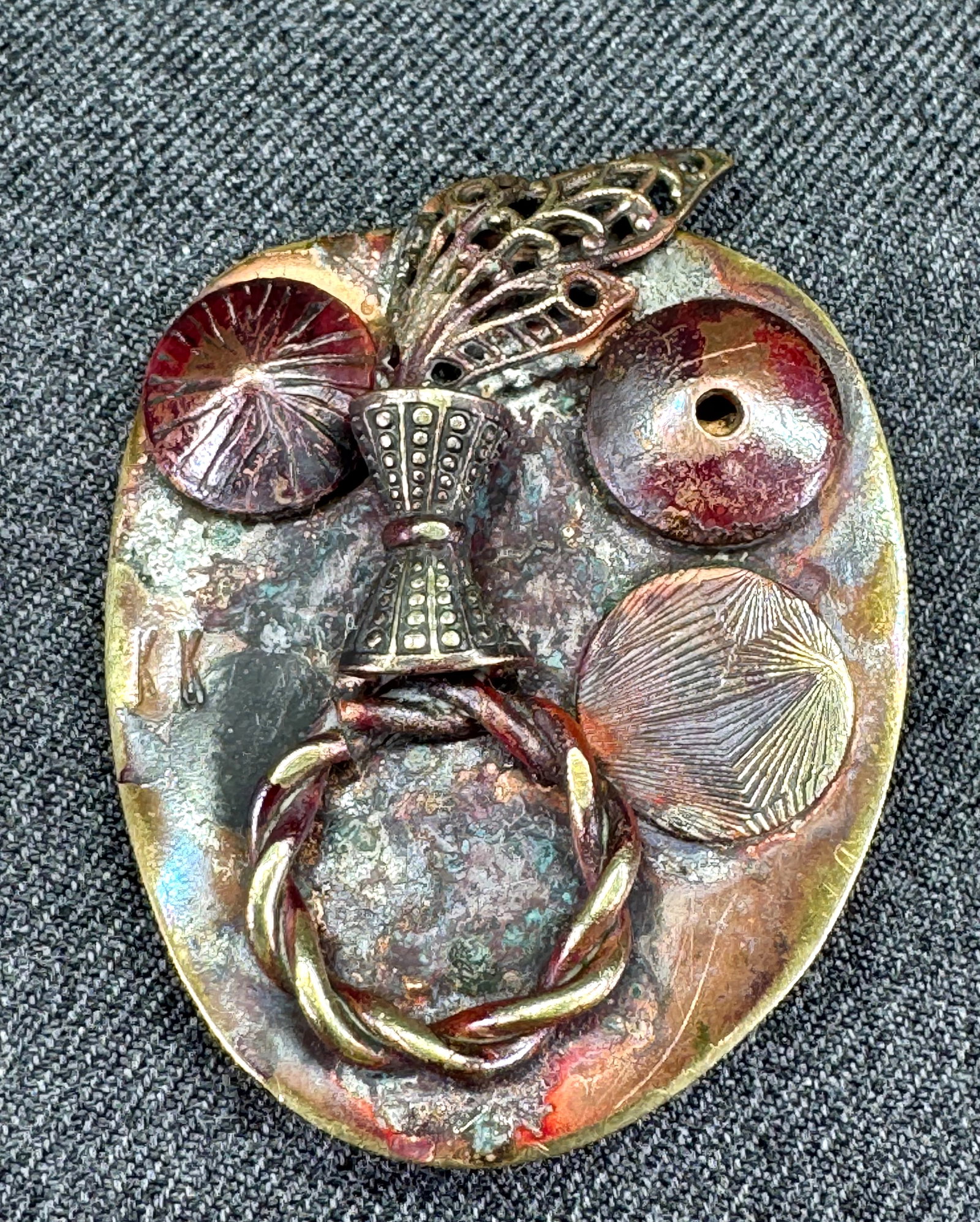 Vintage artsy copper & bronze head brooch pin. Signed KK