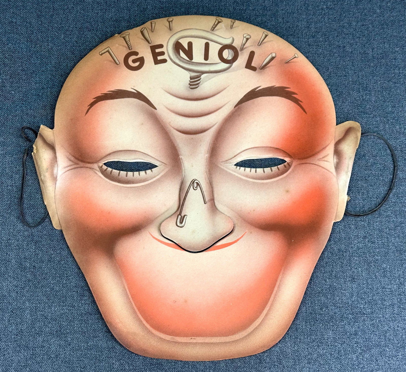 Vintage Lucien Achille Mauzan Geniol ( headache relief) Adv Cardboard Mask.