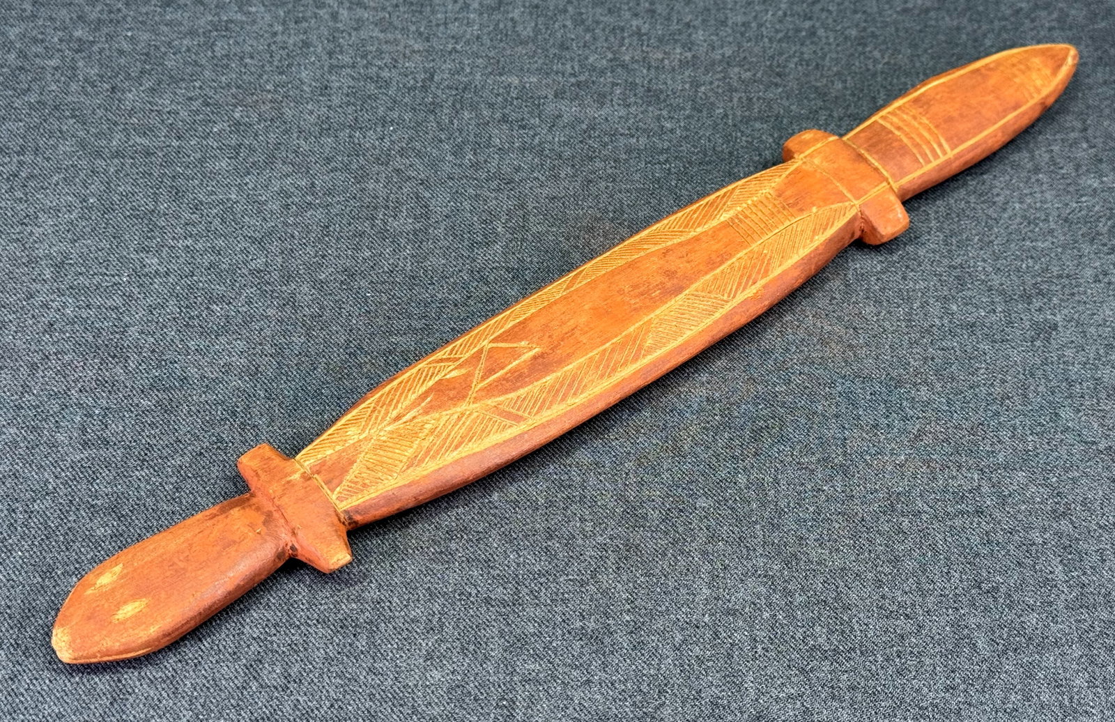 Aboriginal Australia Goanna Figure. Carved and decorated wood with ochre.