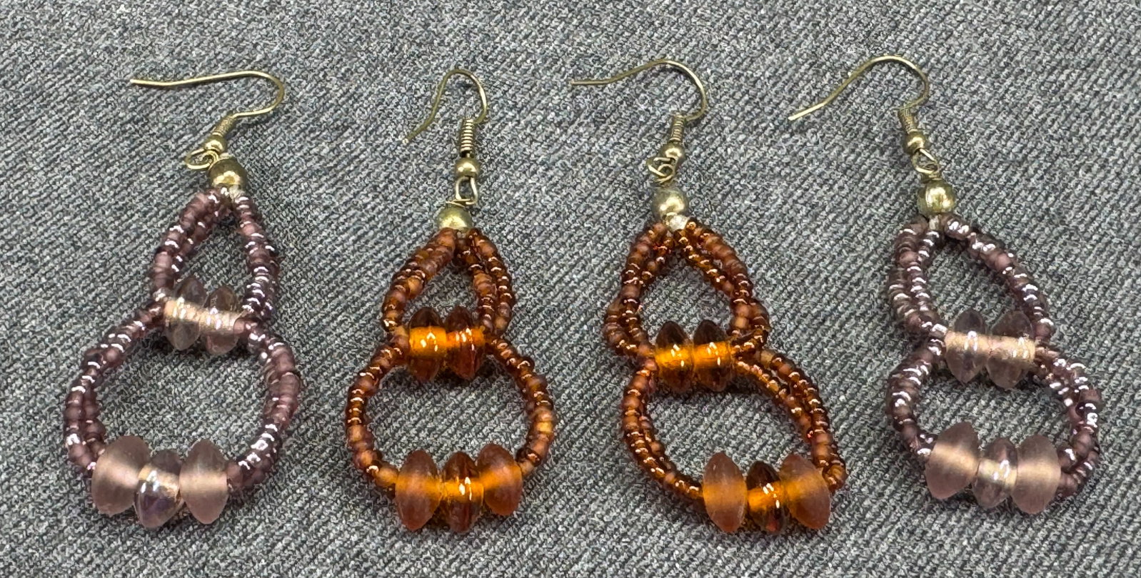 Vintage boho assorted glass beaded drop hook earrings. Lot of 2: Vintage boho assorted glass beaded drop hook earrings. Lot of 2. Unmarked. For measures please refer to the pictures taken with a measuring tape. Weight: 12 Grams . IN HOUSE FLAT SHIPPING & HANDLING C
