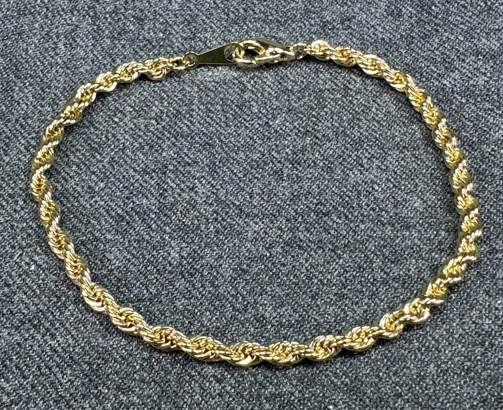 Gold-tone Twisted Braided Rope Bracelet. *i: Gold-tone Twisted Braided Rope Bracelet. Unmarked. For measures please refer to the pictures taken with a measuring tape. Weight: 4 Grams. IN HOUSE FLAT SHIPPING & HANDLING COST WITHIN ALL THE U.S. : 