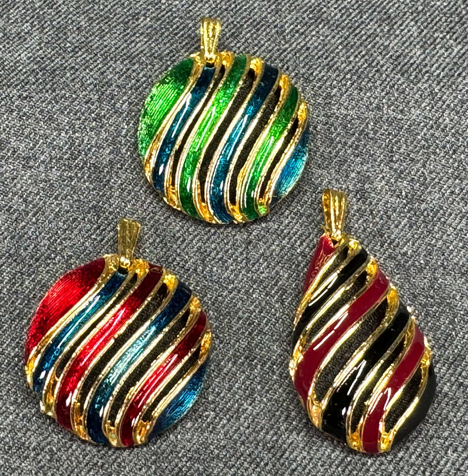 Vintage 80s assorted enamel striped gold-toned metal pendants. Lot of 3