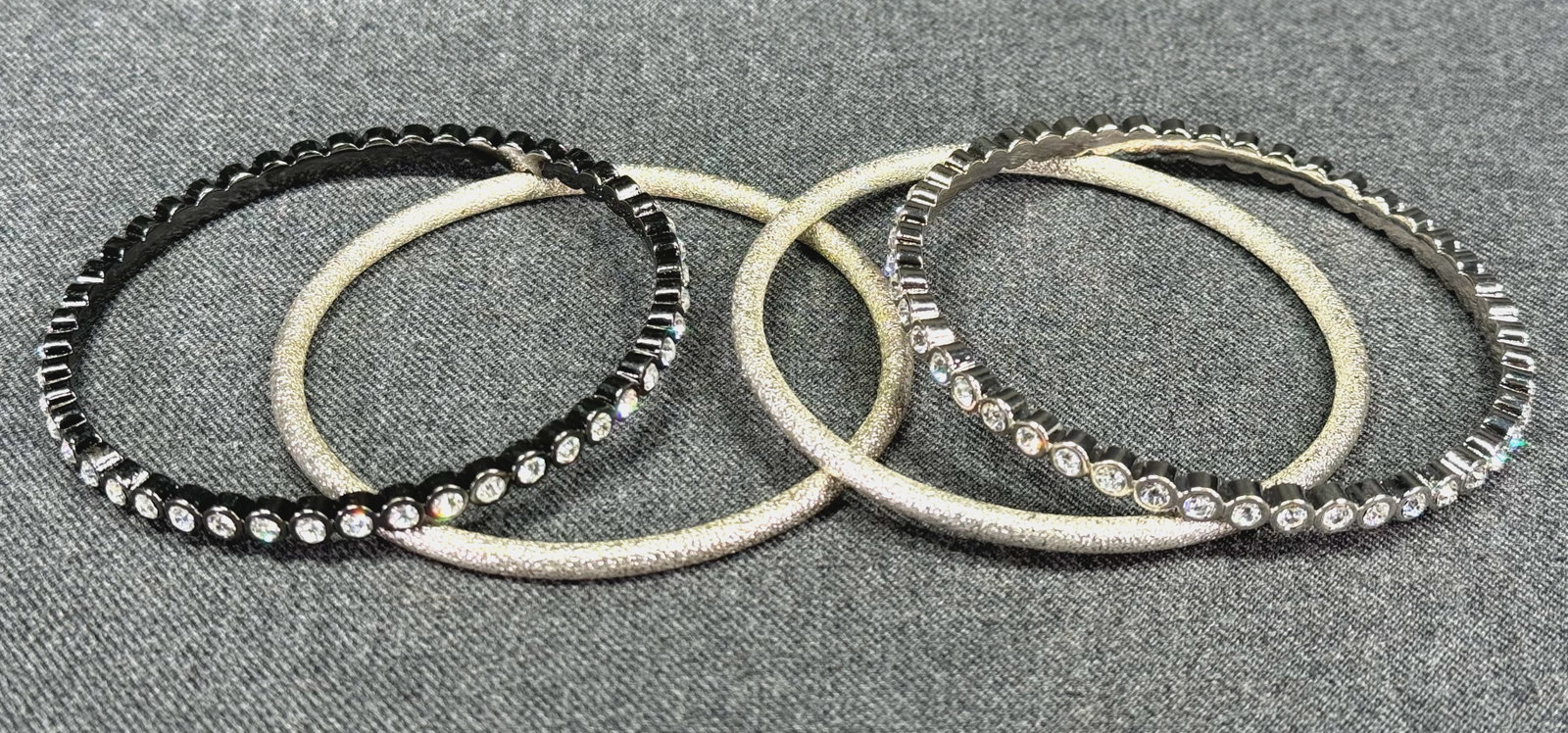 Graziano clear rhinestones gunmetal & silvertone + unbranded brushed silvertone bangles set.