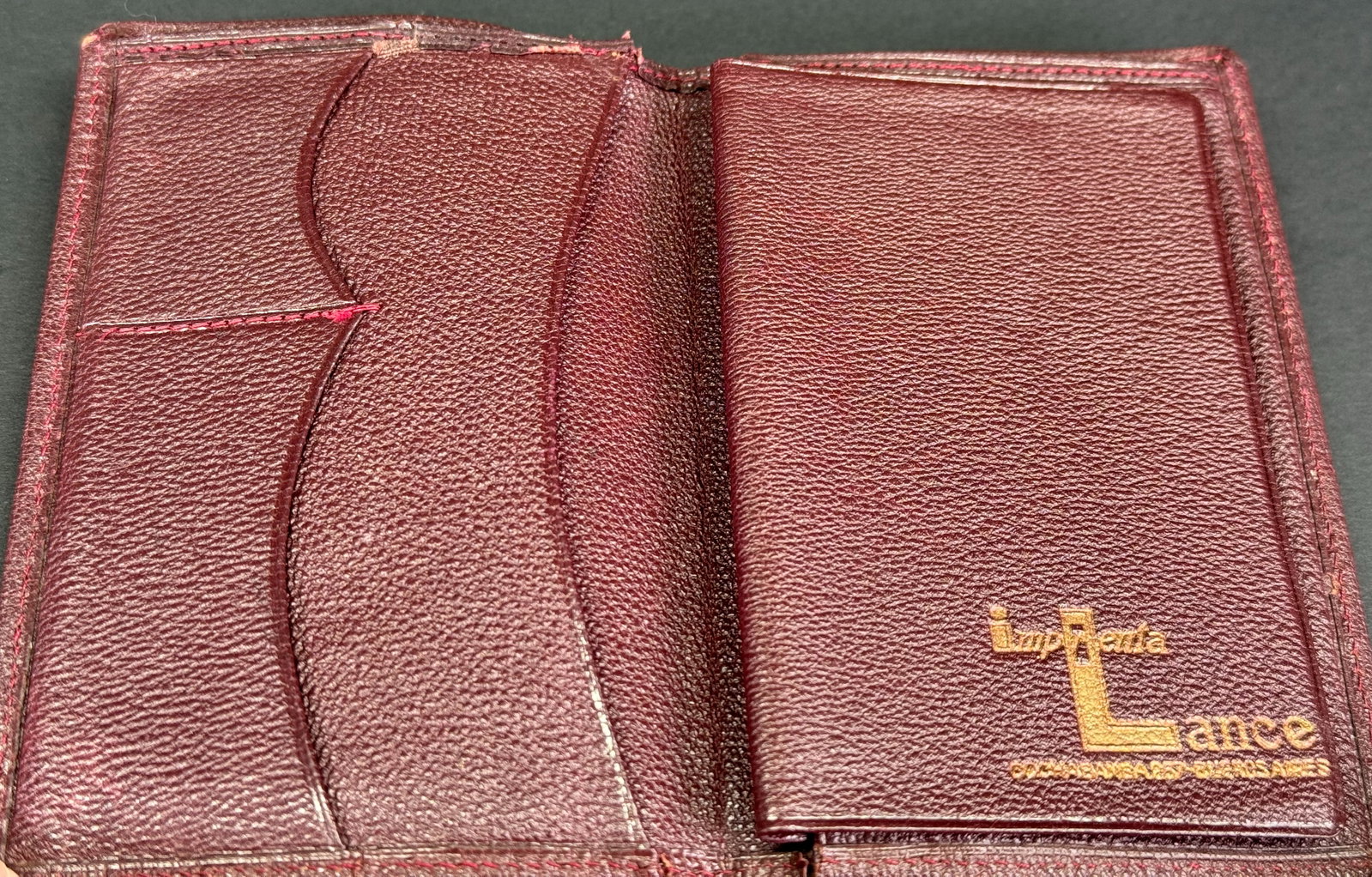Vintage genuine grain leather brown small bifold wallet.