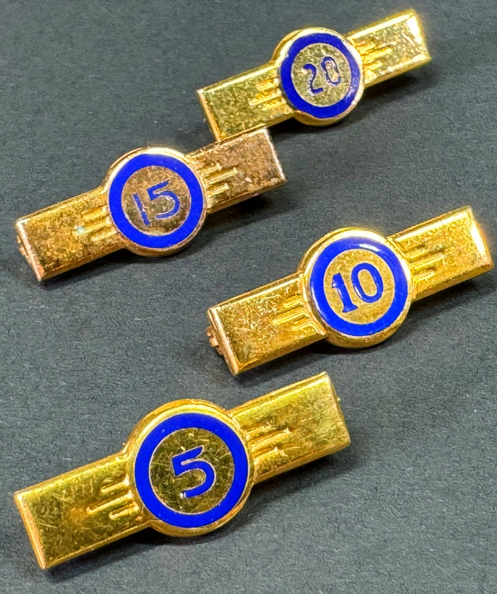 Vintage blue enamel goldtone metal service award for 5, 10, 15 and 20 years pin brooches,