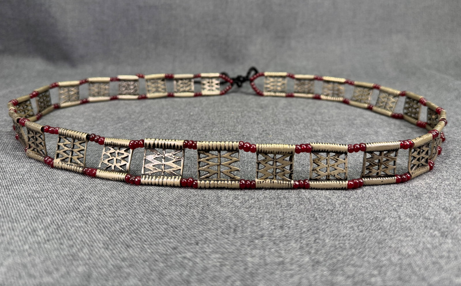 Vintage African Sahel Tribal Belt. Nickel Silver, Glass Trade Beads. *J: Vintage African Sahel Tribal Belt. Nickel Silver, Glass Trade Beads. Unmarked. It measures: Beaded/Metal Section: 30 inches long (the main decorative band). Rope Ties: 6 inches of black cord on each e