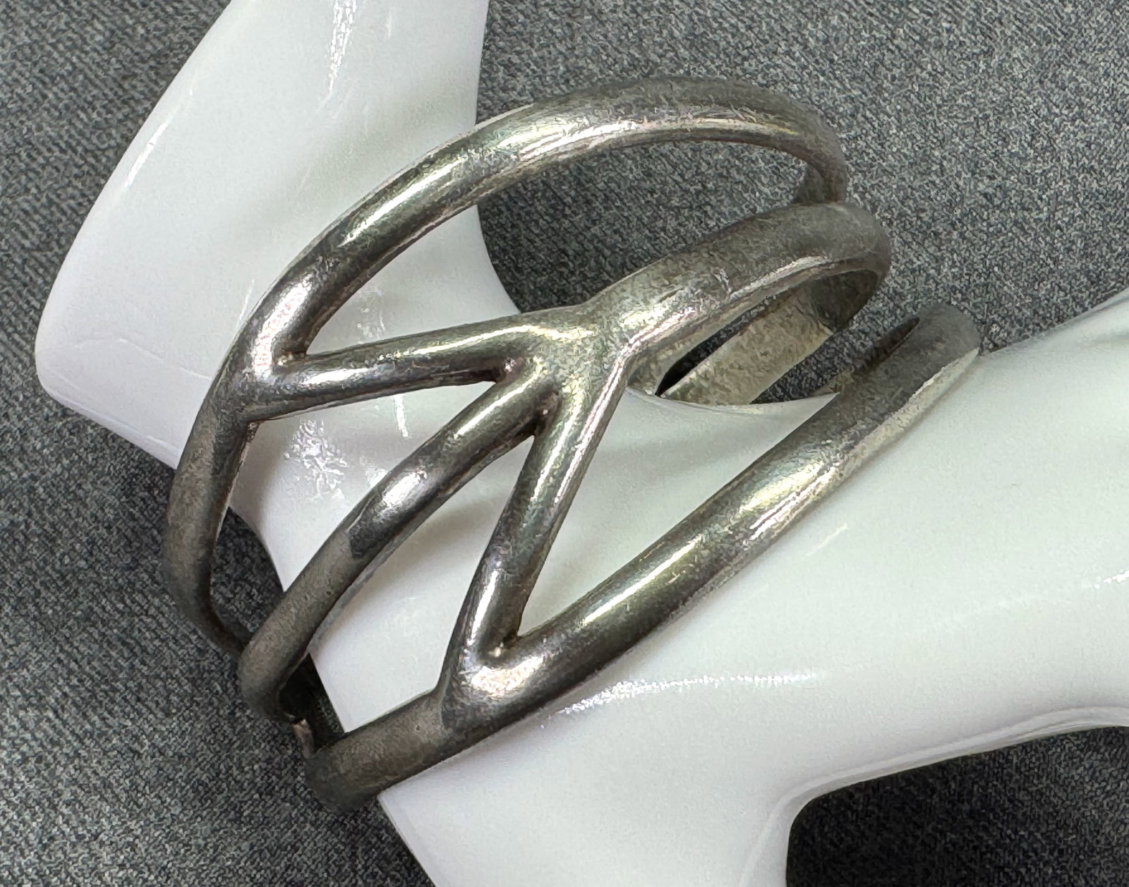Vintage 1990s Lucky You sideways peace symbol cuff bracelet. Silver-tone. *J: Vintage 1990s Lucky You sideways peace symbol cuff bracelet. Silver-tone. Marked. For measures please refer to the pictures taken with a measuring tape. Weight: 48 Grams IN HOUSE FLAT SHIPPING & HANDL