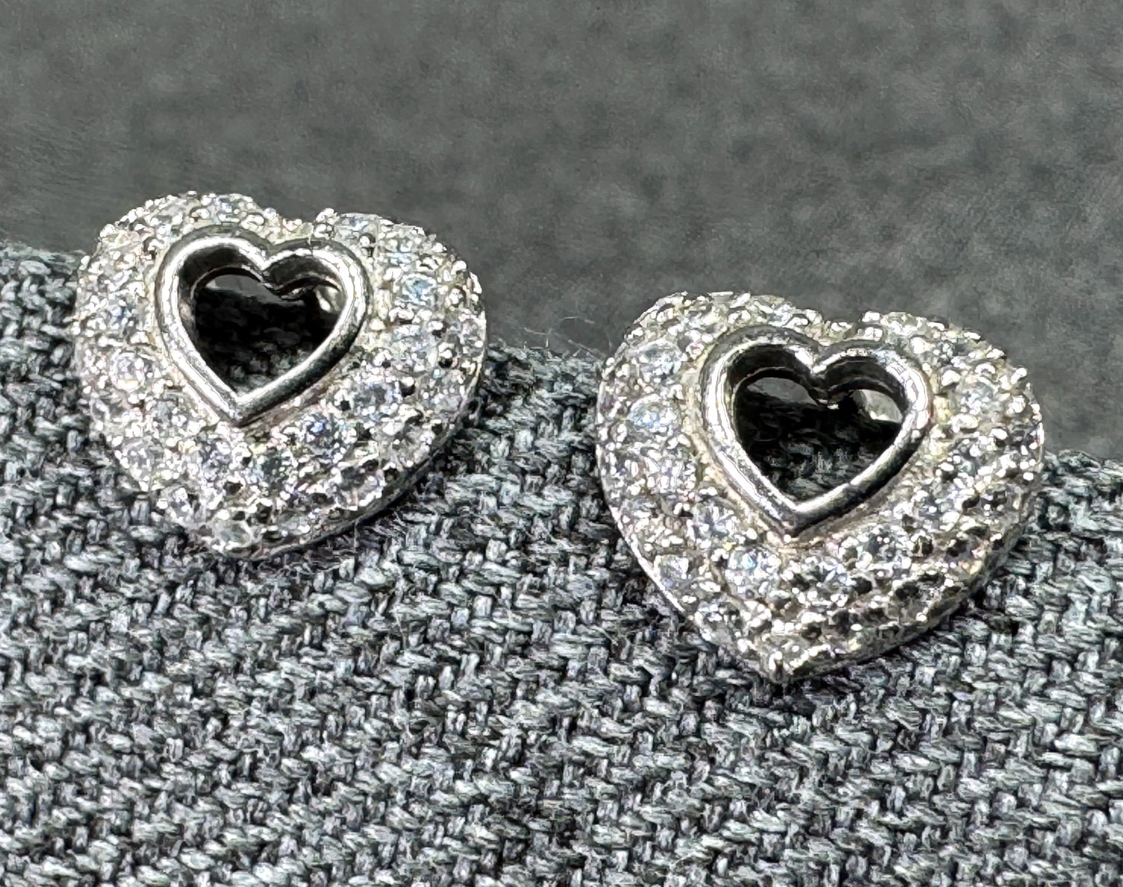 Sterling Silver Pave CZ Open Heart Stud Earrings. *L: Sterling Silver Pave CZ Open Heart Stud Earrings. Marked 925 FAS THAI on the studs and pushbakcs. For measures please refer to the pictures taken with a measuring tape. Weight: 1.61 Grams. IN HOUSE FL