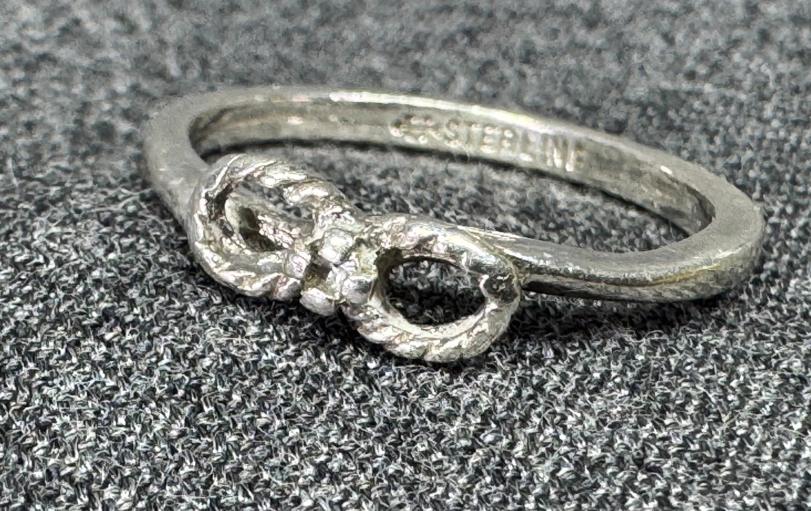Vintage Uncas Sterling diamond woven infinity knot band ring. #B: Vintage Uncas Sterling diamond woven infinity knot band ring. Marked. For measures please refer to the pictures taken with a measuring tape. Weight: 1.64 Grams. IN HOUSE FLAT SHIPPING & HANDLING COST 