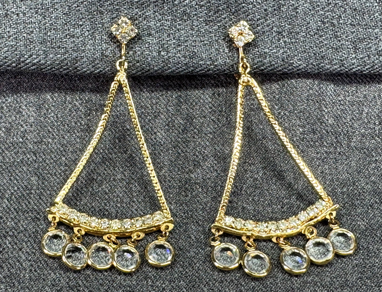 Bezel Set Crystal Chandelier Statement Dangle Clip Earrings. *h: Bezel Set Crystal Chandelier Statement Dangle Clip Earrings. Gold-tone, clear rhinestones. Unmarked. For measures please refer to the pictures taken with a measuring tape. Weight: 12 Grams. IN HOUSE F