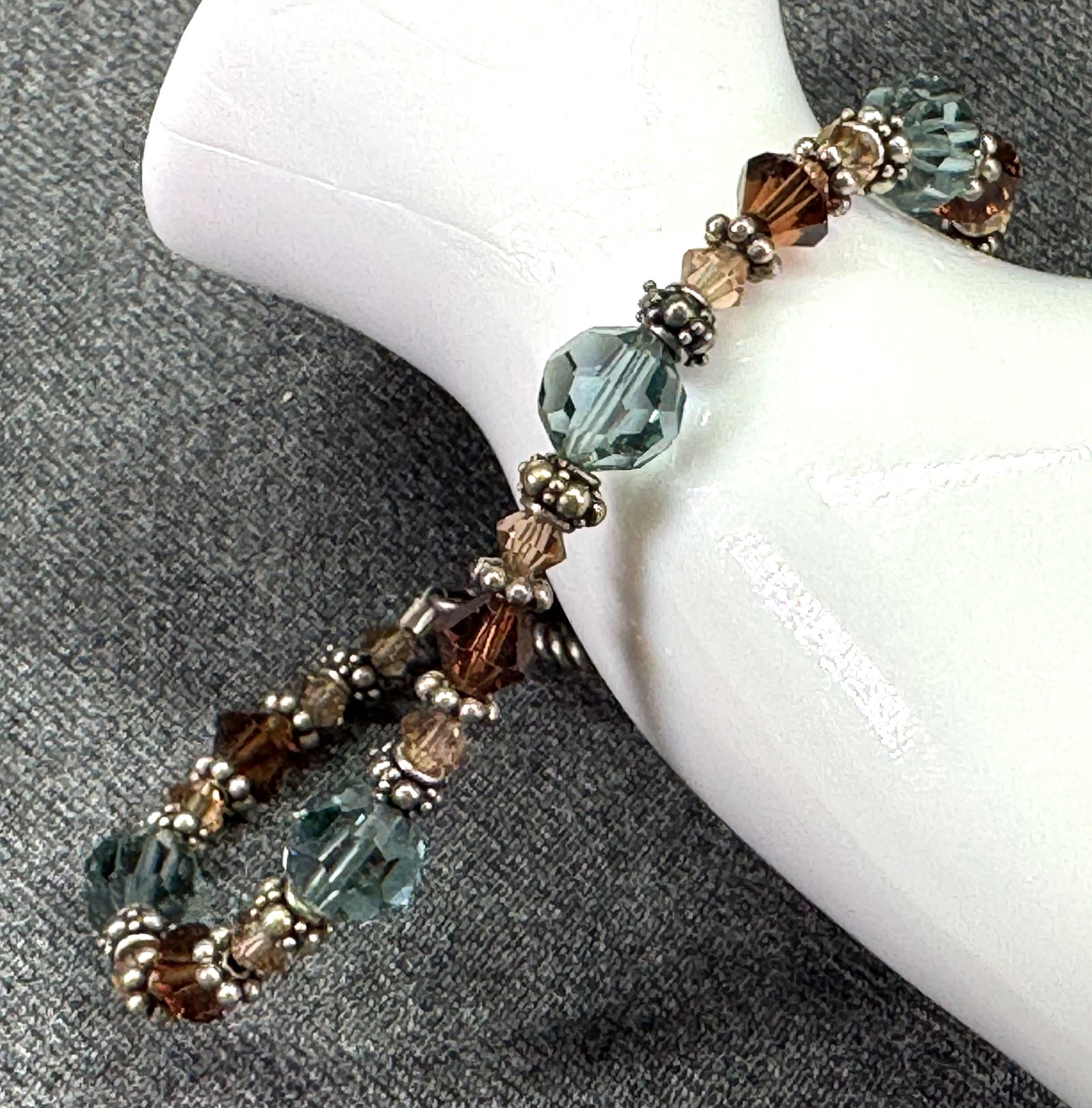 Artisan Earth Tone Swarovski Crystal & Silver Beaded Toggle Bracelet. *L: Artisan Earth Tone Swarovski Crystal & Silver-tone Beaded Toggle Bracelet. Unmarked. For measures please refer to the pictures taken with a measuring tape. Weight: 14 Grams. IN HOUSE FLAT SHIPPING & H