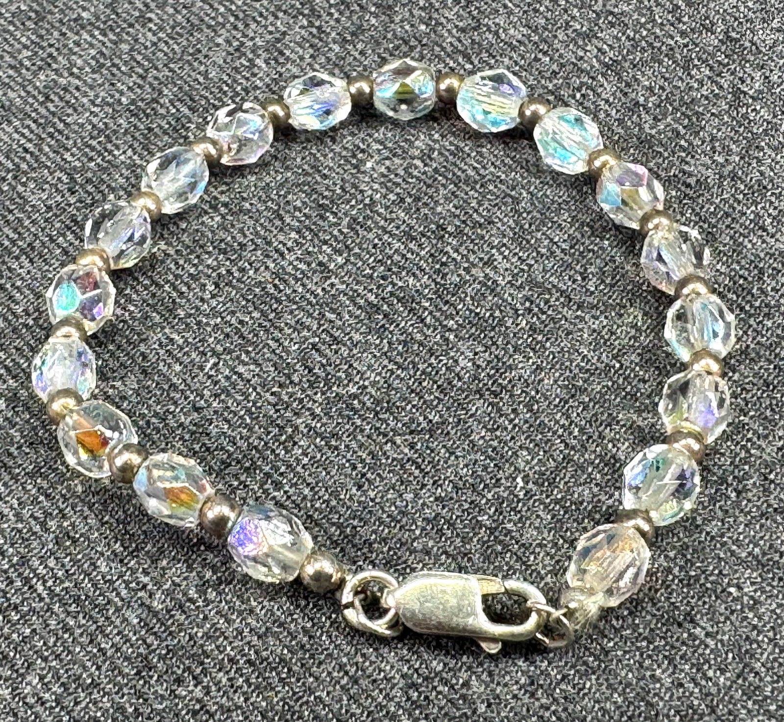 Vintage Sterling Silver & Aurora Borealis Crystal Faceted Bead Bracelet. *L: Vintage Sterling Silver & Aurora Borealis Crystal Faceted Bead Bracelet. Marked 925 on clasp. For measures please refer to the pictures taken with a measuring tape. Weight: 7 Grams. IN HOUSE FLAT SHIP