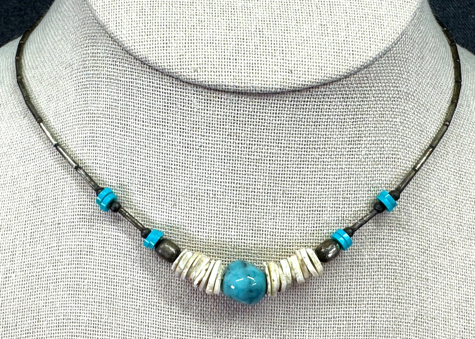 Vintage Native American Faux Turquoise & White Heishi Disc Necklace. *L: Vintage Southwestern Faux Turquoise & White Heishi Disc Necklace.Unmarked. For measures please refer to the pictures taken with a measuring tape. Weight: 8 Grams. IN HOUSE FLAT SHIPPING & HANDLING COS