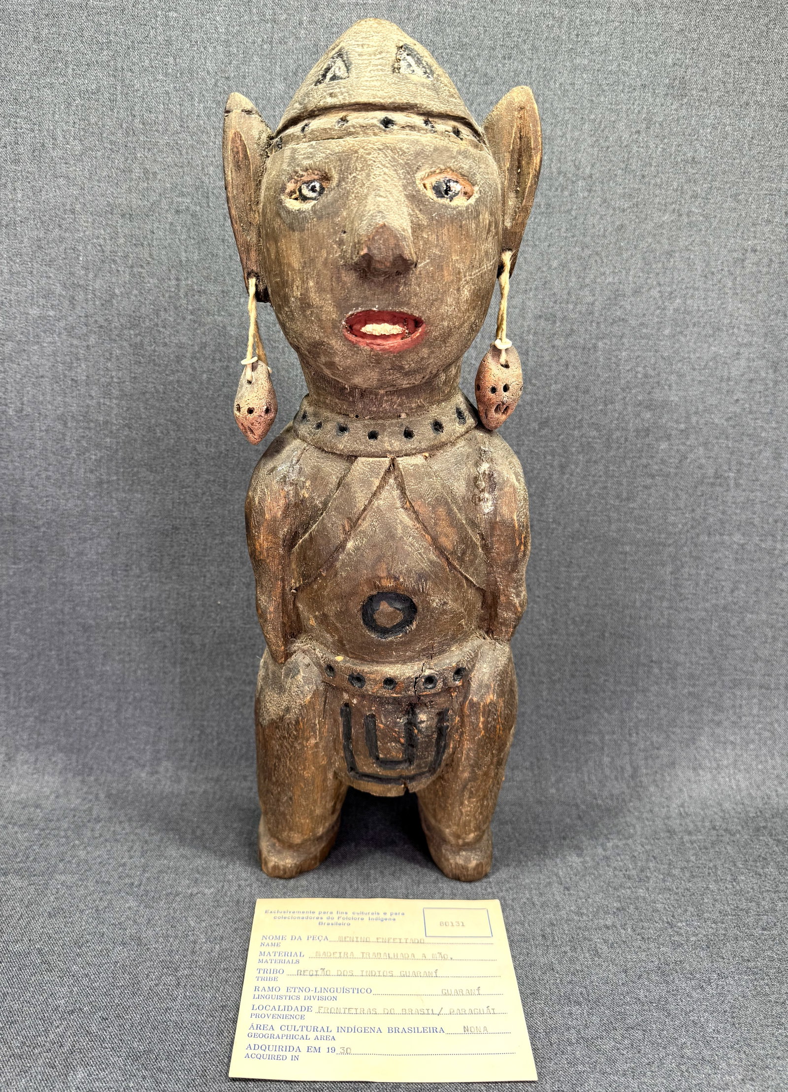 Antique Brazil - Paraguay Frontier Guarani Figure. Coll. 1930 with COA: Antique Brazil - Paraguay Frontier Guarani People “Menino Enfeitado” (Adorned Boy) Figure. Carved wood, natural pigments, natural fibers, ceramic. Certificate of authenticity. Year of coll
