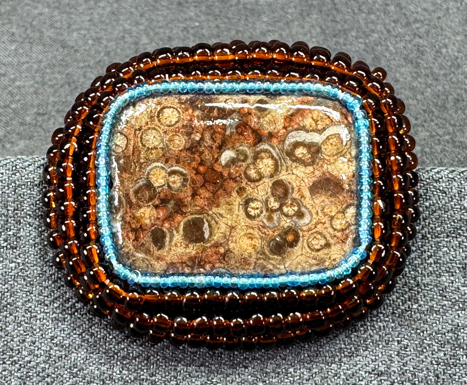 Artisan Hand Crafted Orbicular Jasper Cab Glass Beaded Setting Pin Brooch. *L: Artisan Hand Crafted Orbicular Jasper Cab Glass Beaded Setting Pin Brooch. Unmarked. For measures please refer to the pictures taken with a measuring tape. Weight: 30 Grams. IN HOUSE FLAT SHIPPING & H