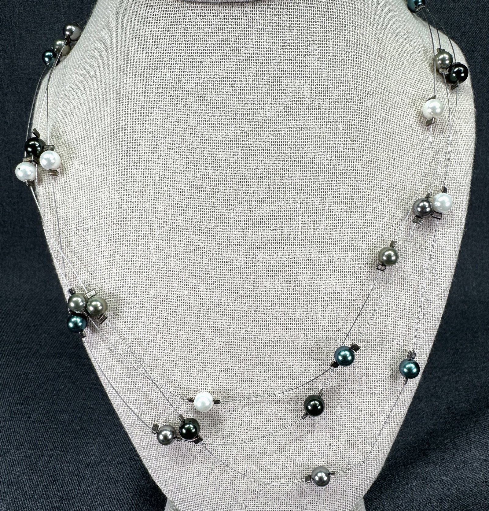 Artisan Multi-Strand Floating Illusion Color Faux Pearl Necklace. Silver-tone clasp. *J: Artisan Multi-Strand Floating Illusion Color Faux Pearl Necklace. Silver-tone clasp. Unmarked. For measures please refer to the pictures taken with a measuring tape. Weight: 20 Grams. IN HOUSE FLAT SH