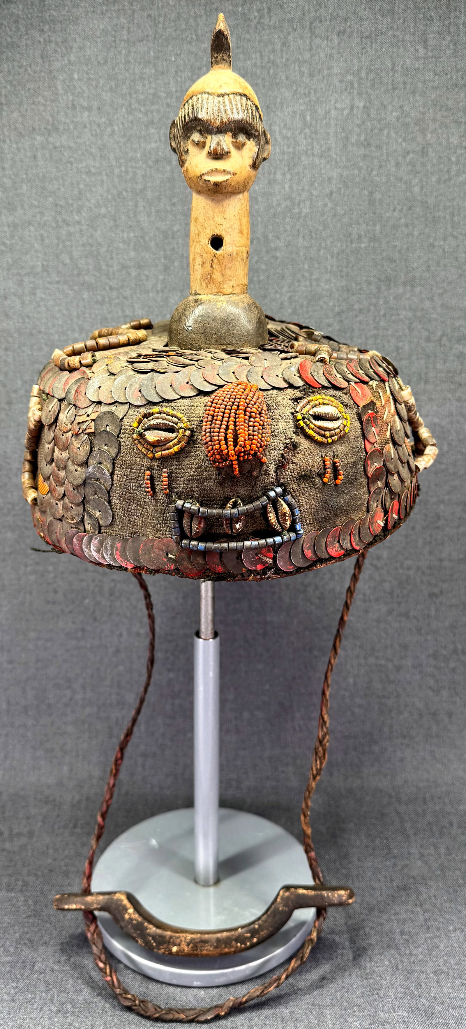 African Igbo Helmet Mask: African Igbo Helmet Mask. Carved wood, fabric, fiber, beads, cowrie shells, discs, braided leather. For measures please refer to the pictures taken with a measuring tape. Weight: 1Lb 5Oz. IN HOUSE FLA