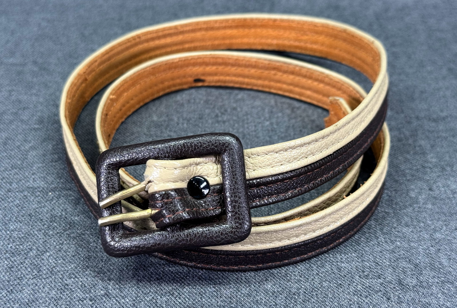 Vintage Argentina Pebbled Nappa Leather Two-Tone Skinny Belt. Double Prong buckle. *L: Vintage Argentina Pebbled Nappa Leather Two-Tone Skinny Belt. Double Prong buckle. Marked. For measures please refer to the pictures taken with a measuring tape. Weight: 24 Grams. IN HOUSE FLAT SHIPPI