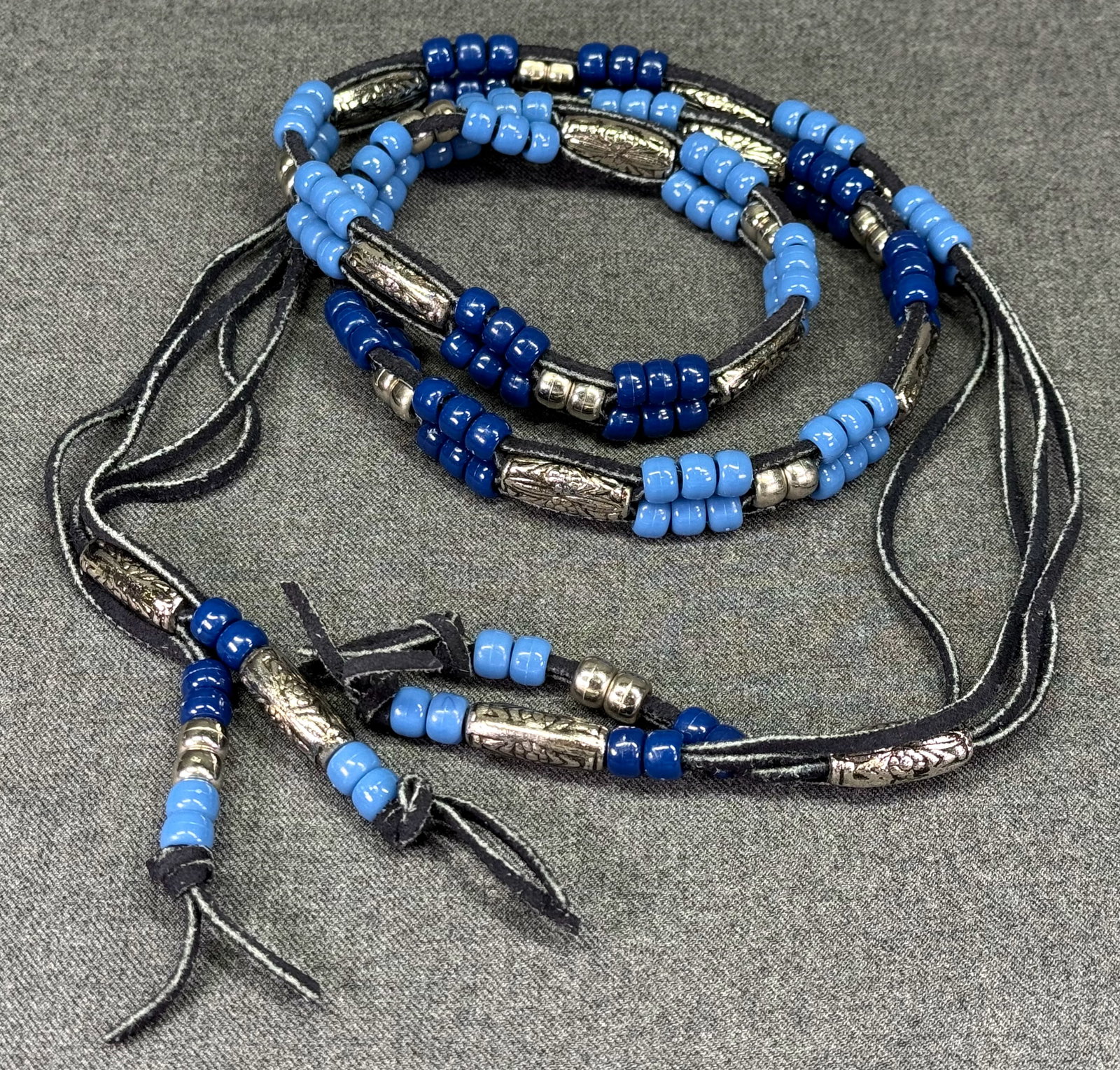 Vintage Southwestern Style Blue Plastic, Silver-tone Beads Black Suede Tie Belt . *L: Vintage Southwestern Style Blue Plastic, Silver-tone Beads Black Suede Tie Belt. Unmarked. For measures please refer to the pictures taken with a measuring tape. Weight: 80 Grams. IN HOUSE FLAT SHIPPI