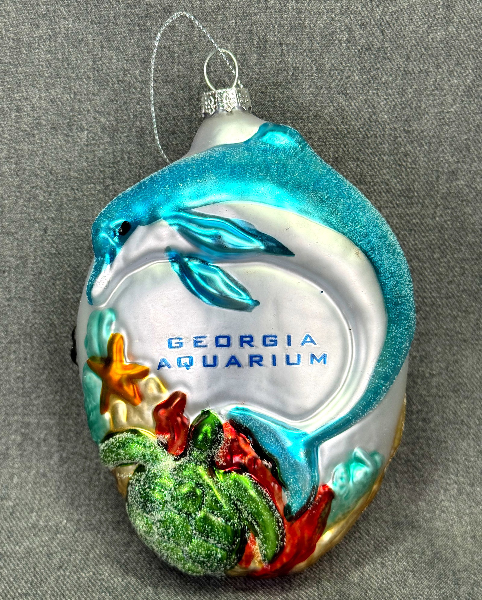 Georgia Aquarium Marine Life Blown Glass Christmas Ornament. *L: Georgia Aquarium Marine Life Blown Glass Christmas Ornament. Unmarked. For measures please refer to the pictures taken with a measuring tape. Weight: 42 Grams. IN HOUSE FLAT SHIPPING & HANDLING COST W