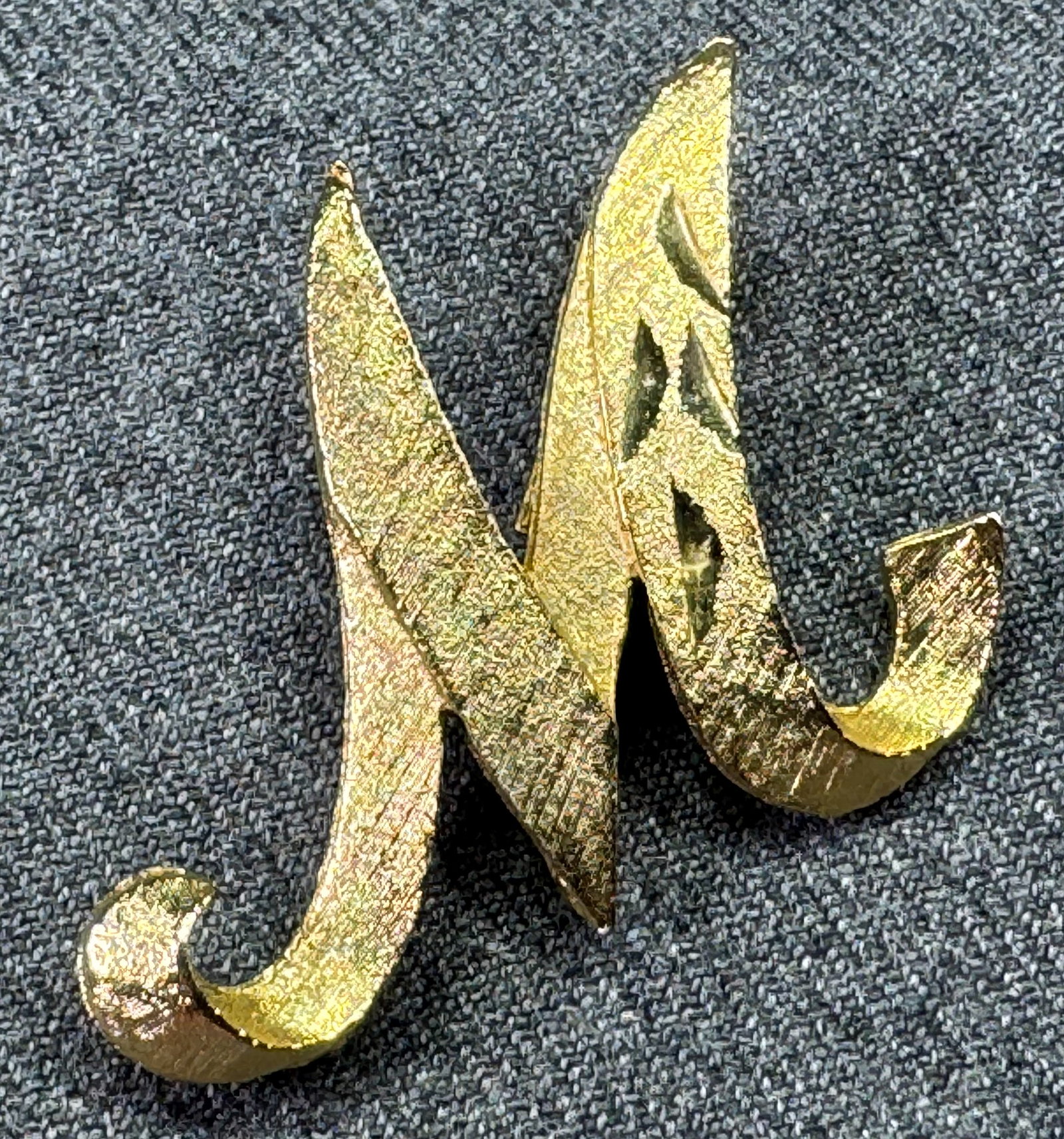 Vintage Mamselle Cursive Initial "M" Brooch Pin. *f: Vintage Mamselle Signed Gold Tone Textured Cursive Initial "M" Brooch Pin. Marked For measures please refer to the pictures taken with a measuring tape. Weight: 9 Grams. IN HOUSE FLAT SHIPPING & HANDL