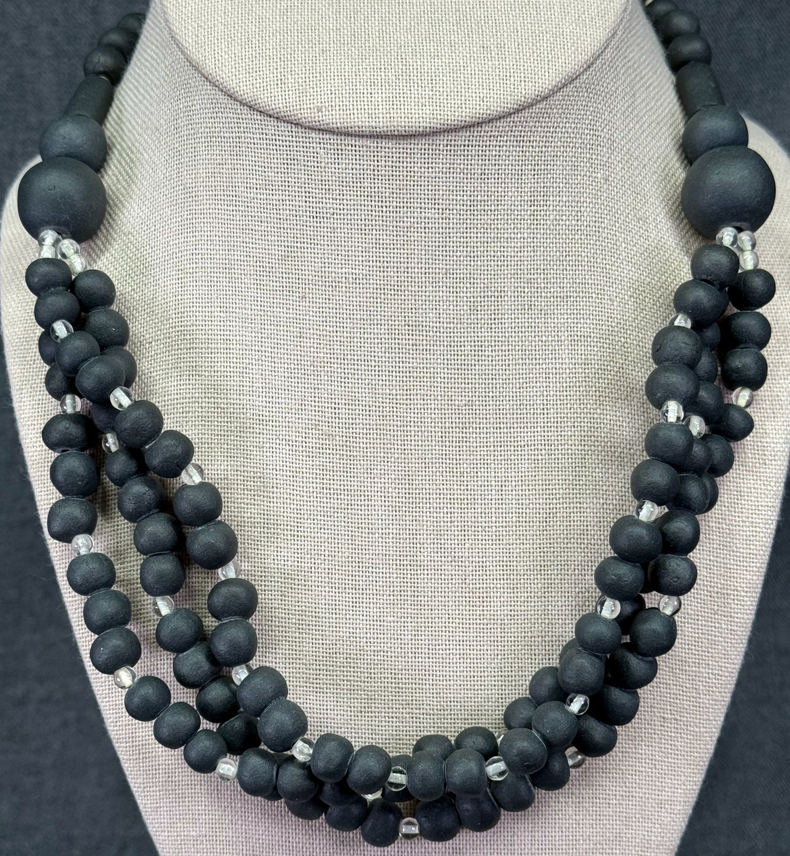 Vintage artisan black pottery & clear glass 3 strands collar necklace. *d: Vintage artisan black pottery & clear glass 3 strands collar necklace. Unmarked. For measures please refer to the pictures taken with a measuring tape. Weight: 80 Grams. IN HOUSE FLAT SHIPPING & HANDL