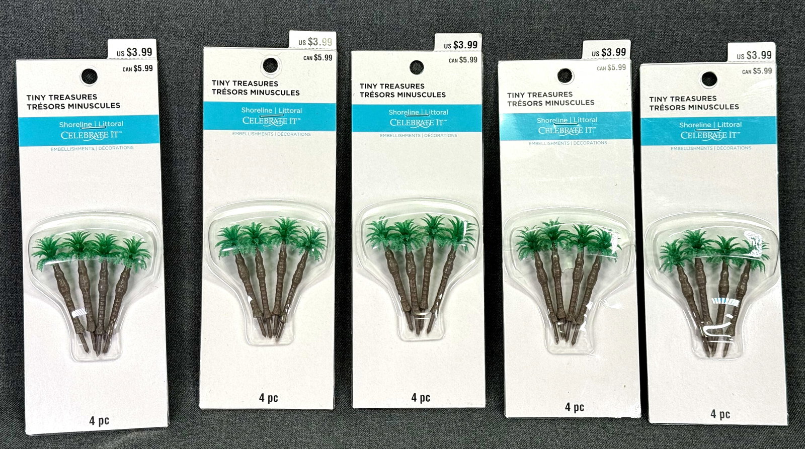 Celebrate It tiny Treasures miniature palm trees. Lot of 5 packages: Celebrate It tiny Treasures miniature palm trees in their original packaging. Lot of 5 packages containing 4 palms each. For measures please refer to the pictures taken with a measuring tape. Weight: 