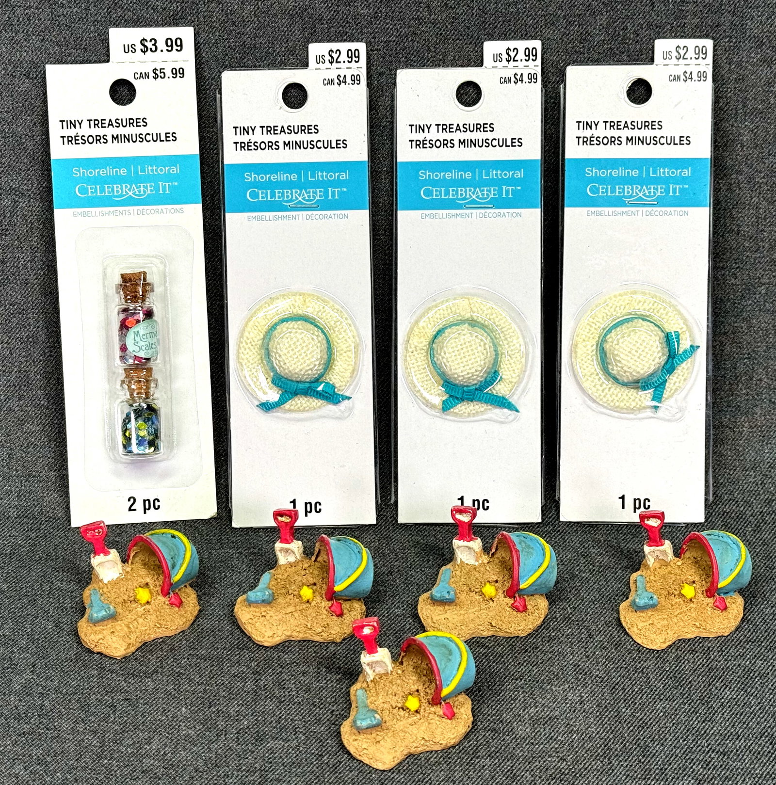 Celebrate It tiny Treasures miniature beach hats, buckets & mermaid scales's bottles.: Celebrate It tiny Treasures miniature 3 beach hat in original paclaging,5 beach buckets & 2 mermaid scales's bottles in one original packaging. For measures please refer to the pictures taken with a m