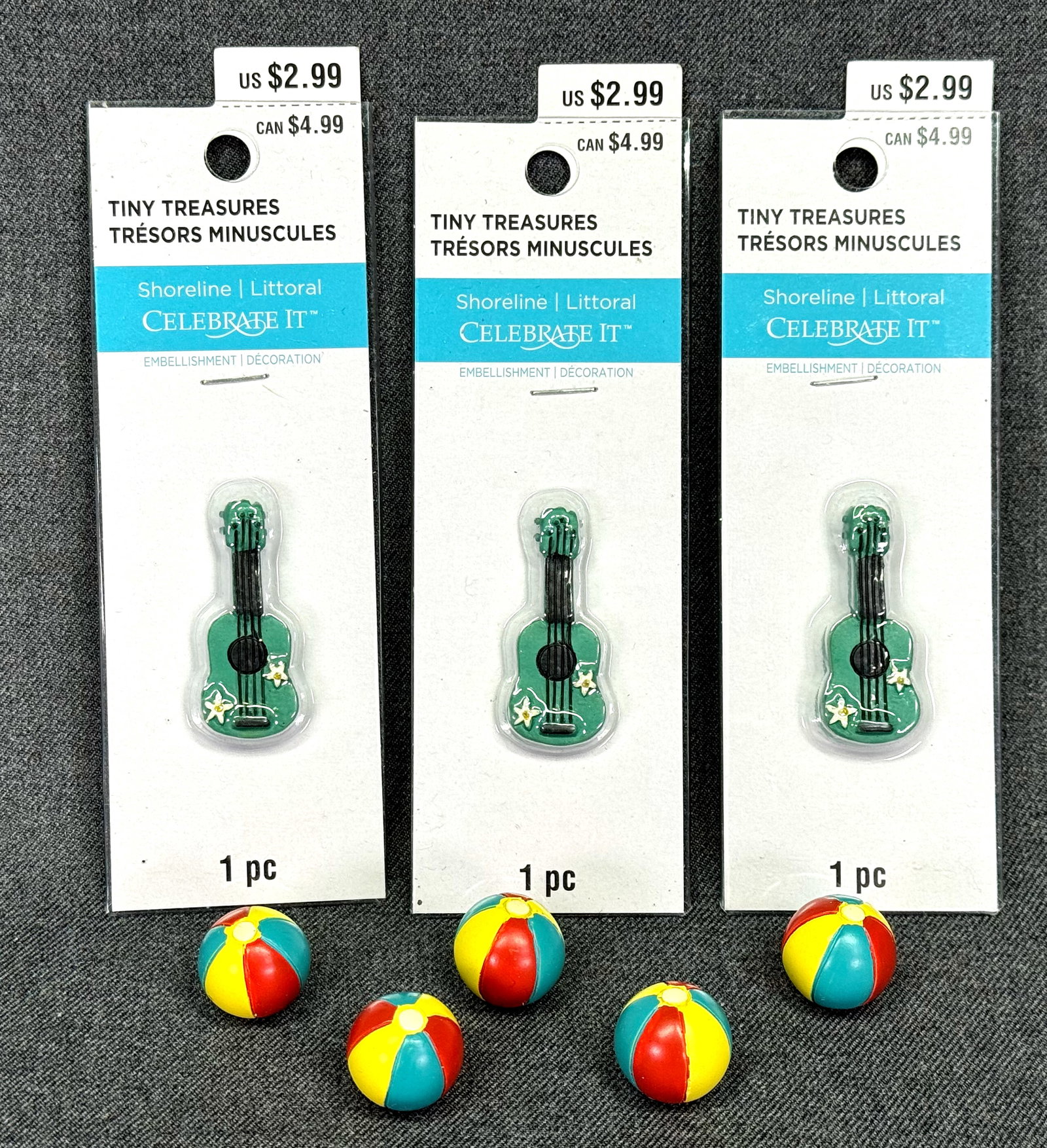 Celebrate It tiny Treasures miniature beach balls & guitars: Celebrate It tiny Treasures miniature 3 decorated with flowers guitars in their original packaging and 5 beach balls. For measures please refer to the pictures taken with a measuring tape. Weight: 62 
