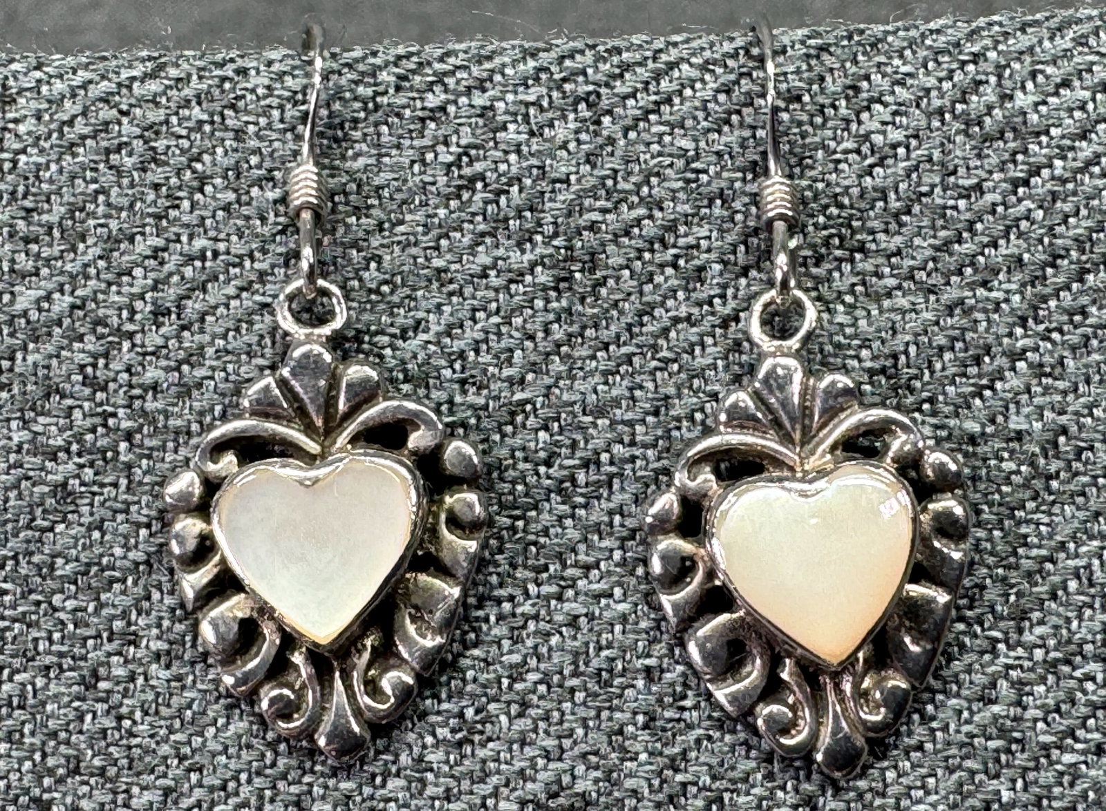 Sterling Silver White Mother of Pearl Heart Dangle Hook Earrings. Marked. *n: Sterling Silver White Mother of Pearl Heart Dangle Hook Earrings. Marked 925 on hearta & hooks. For measures please refer to the pictures taken with a measuring tape. Weight: 3.35 Grams. IN HOUSE FLAT