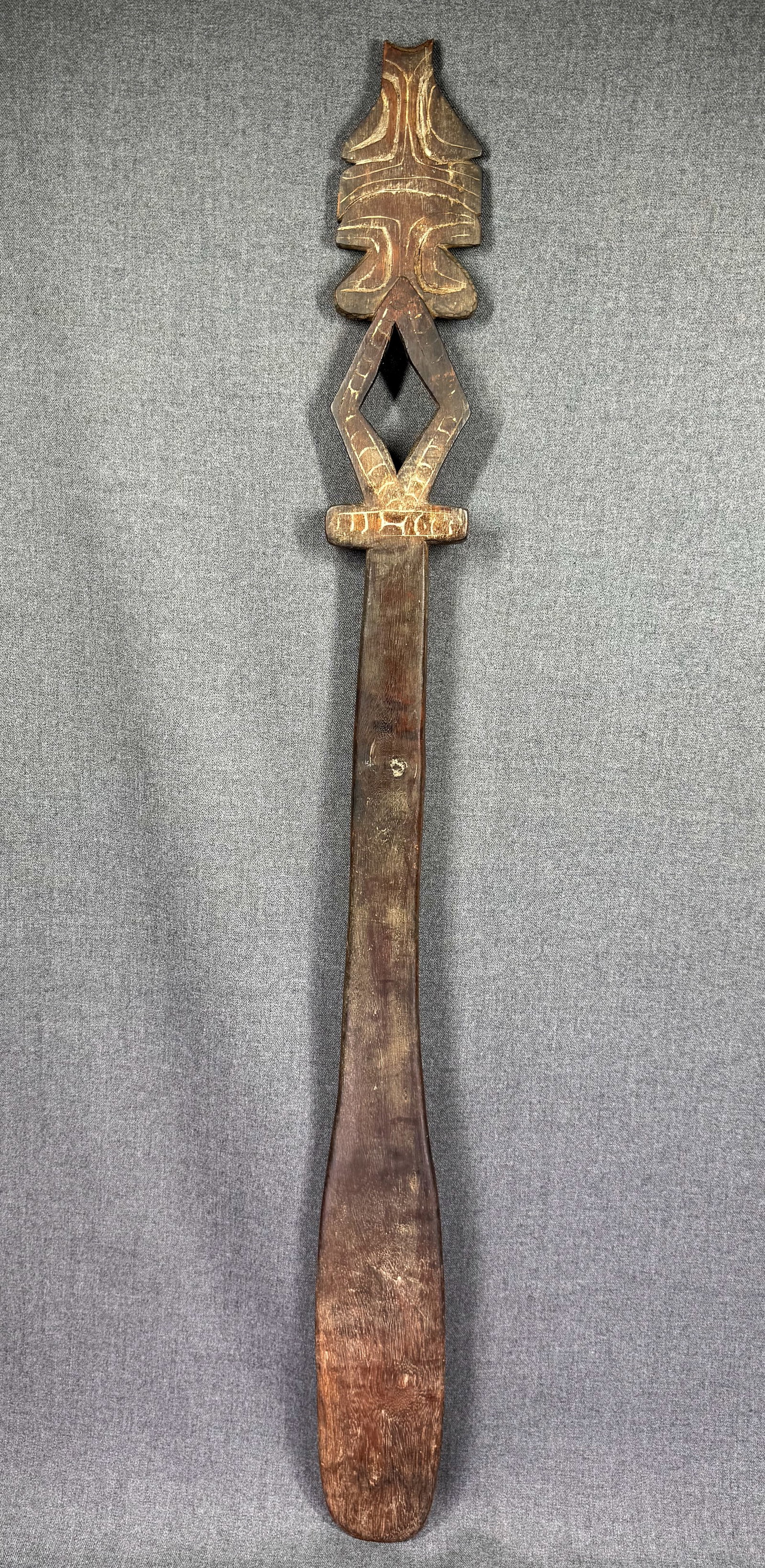 Trobriand Islands Massim Spatula/Sword Club. *i: Trobriand Islands Massim Spatula/Sword Club.Carved and decorated wood, rests of infill. For measures please refer to the pictures taken with a measuring tape. IN HOUSE FLAT SHIPPING & HANDLING COST WI