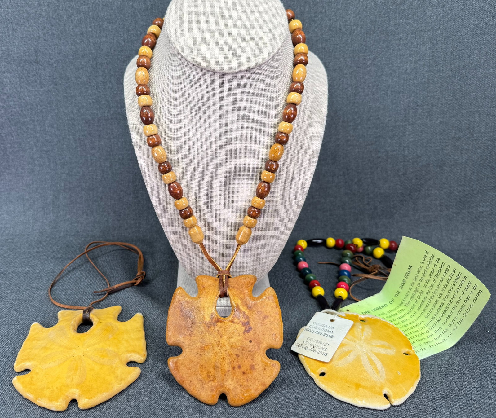 Cover-Up Creations Arizona Large sand dollar wooden beads leather strap necklace. Lot of 3 *M: Cover-Up Creations Arizona sand dollar wooden beads leather strap necklace. Lot of 3. For measures please refer to the pictures taken with a measuring tape. Weight: 125 Grams. IN HOUSE FLAT SHIPPING &