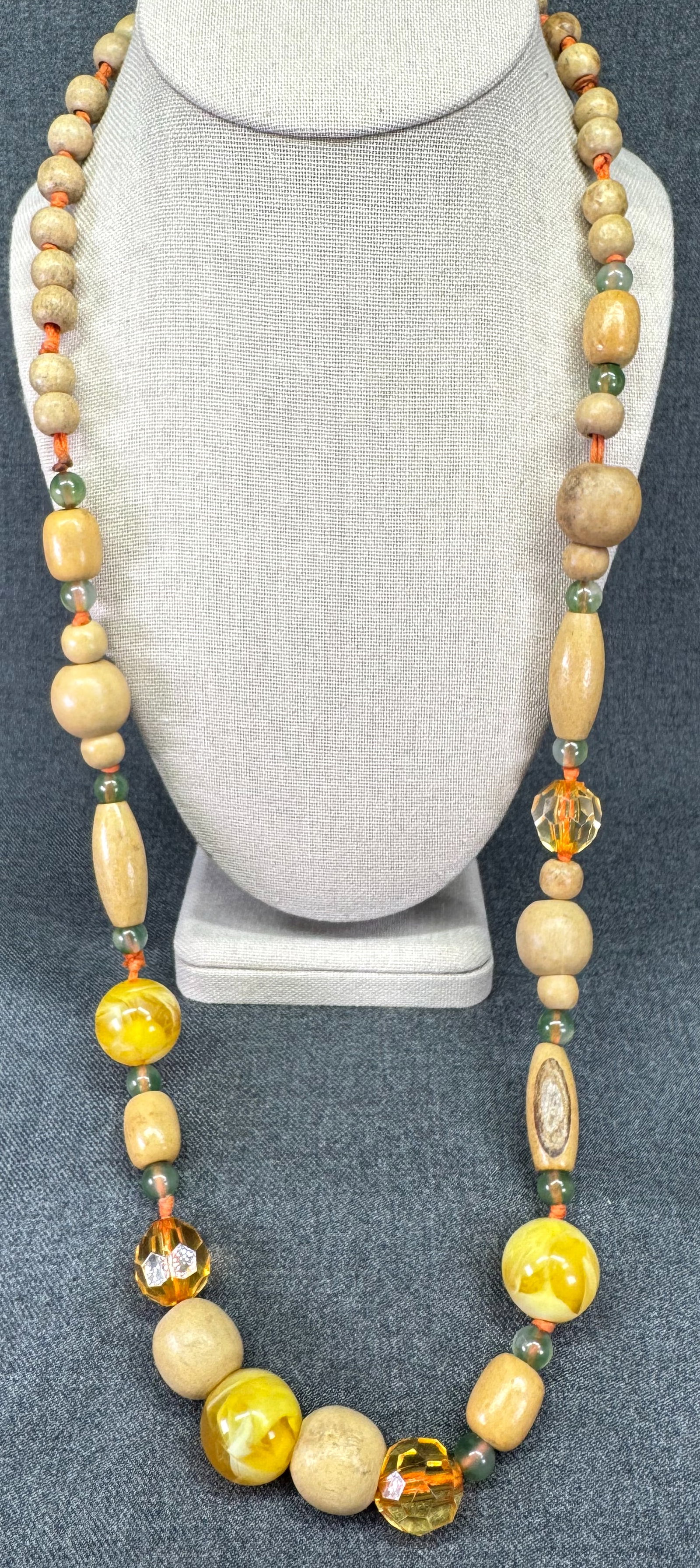 Vintage artisan crafted wooden & lucite beads necklace. #a: Vintage bluish resin beads gold-toned snake chain 3 strands necklace. Unmarked. For measures please refer to the pictures taken with a measuring tape. Weight: 46 Grams. IN HOUSE FLAT SHIPPING & HANDLI