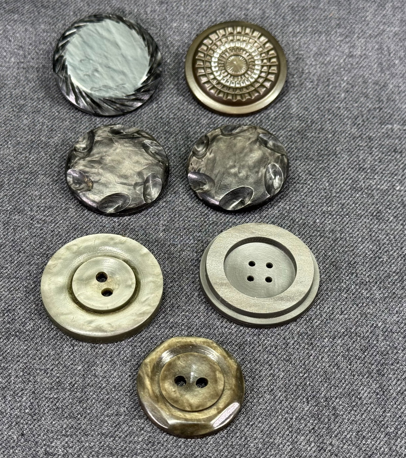 Vintage assorted grayish galalith buttons. Lot of 7: IN HOUSE FLAT SHIPPING & HANDLING COST WITHIN ALL THE U.S. : $7 To bypass LiveShipping, and use our In-House shipping service for $7 or shipping combined for multiple lots, please select “Arrang