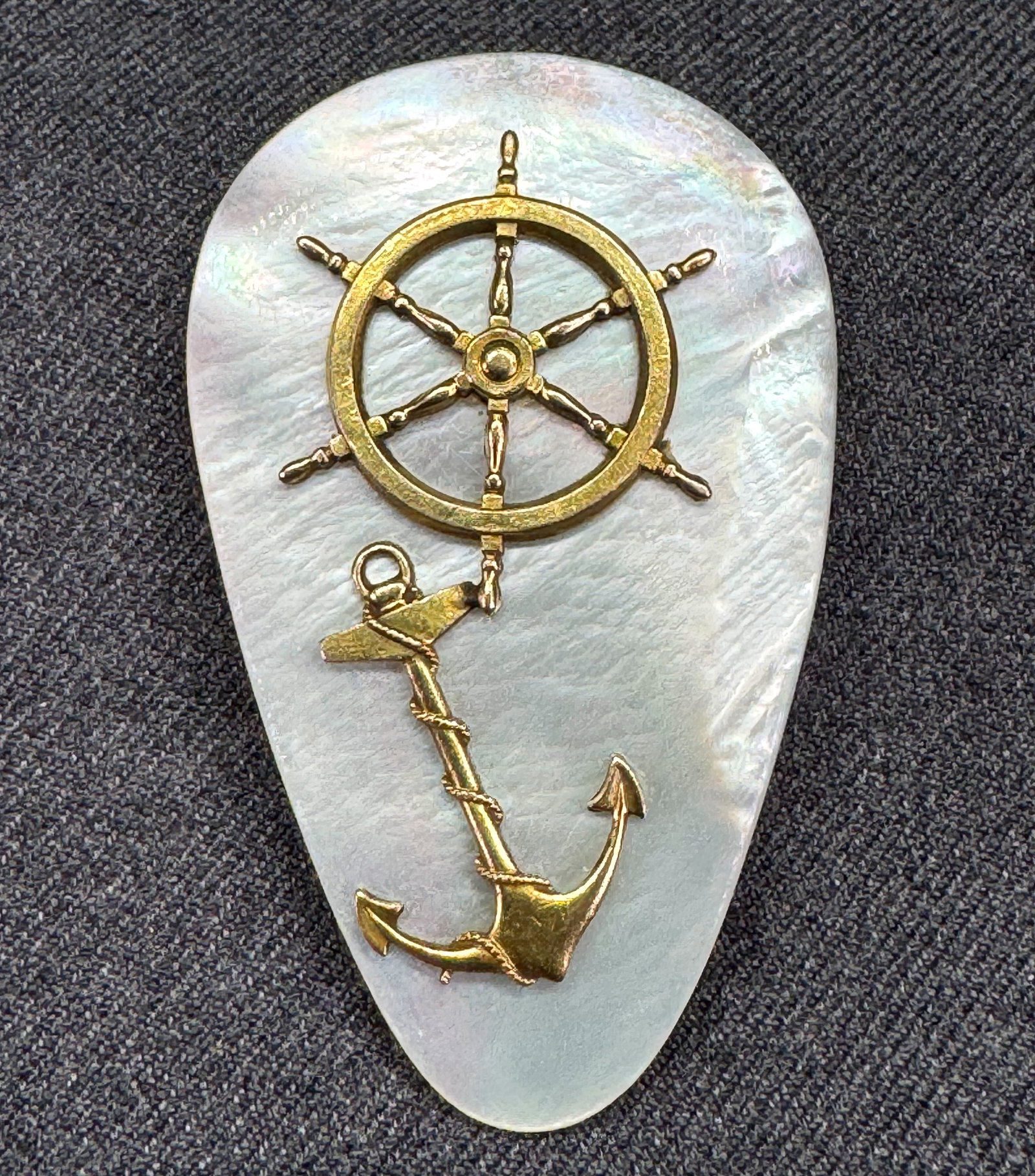 Art Deco Signed R Nautical MOP Dress Clip . *o: Vintage Art Deco Mother of Pearl Navy Nautical Dress Clip. Anchor& Ships Wheel. Signed R. Gold-tone metal. For measures please refer to the pictures taken with a measuring tape. Weight: 22 Grams. IN H
