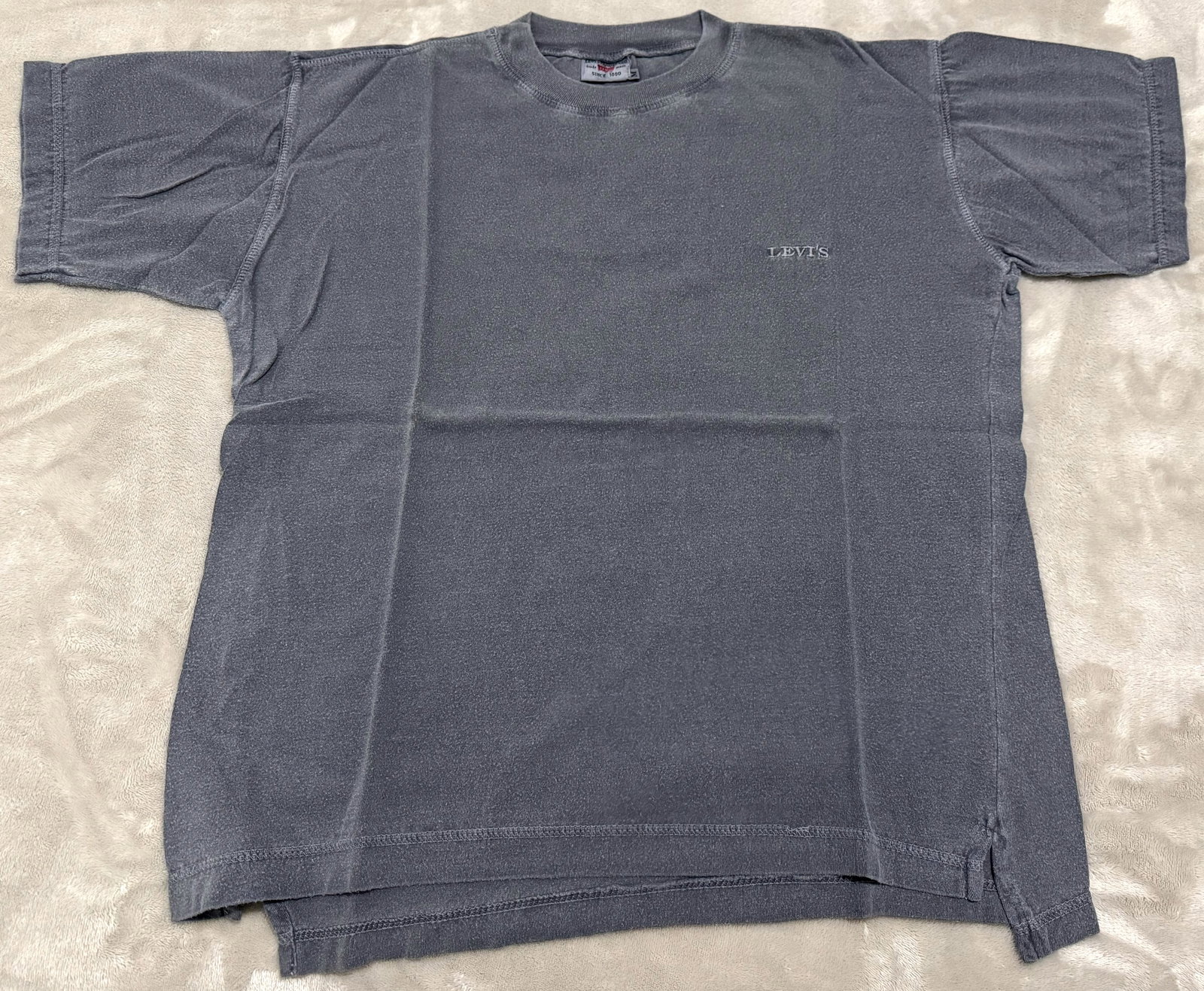 NOS 90s Vintage Levis Short Sleeve Charcoal Faded Embroidered T-Shirt: Unused Embroidered "LEVI'S" Vintage 1990s Levi Strauss & Co. Short-sleeve crewneck t-shirt. serif-style embroidered "LEVI'S" logo on the left chest and classic side slits at the lower hem. 100% Cotton