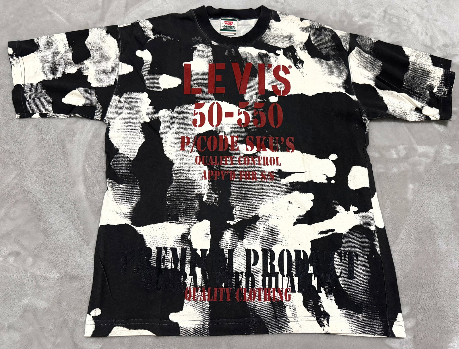 NOS 90s Vintage Levis Camo All Over Print AOP 501 550 Grail T-Shirt: Unused True vintage 1990s Levi Strauss & Co. short-sleeve crewneck t-shirt. Rare all-over print (AOP) abstract camouflage/acid wash pattern backdrop. Bold multi-layered chest graphics reference the ic