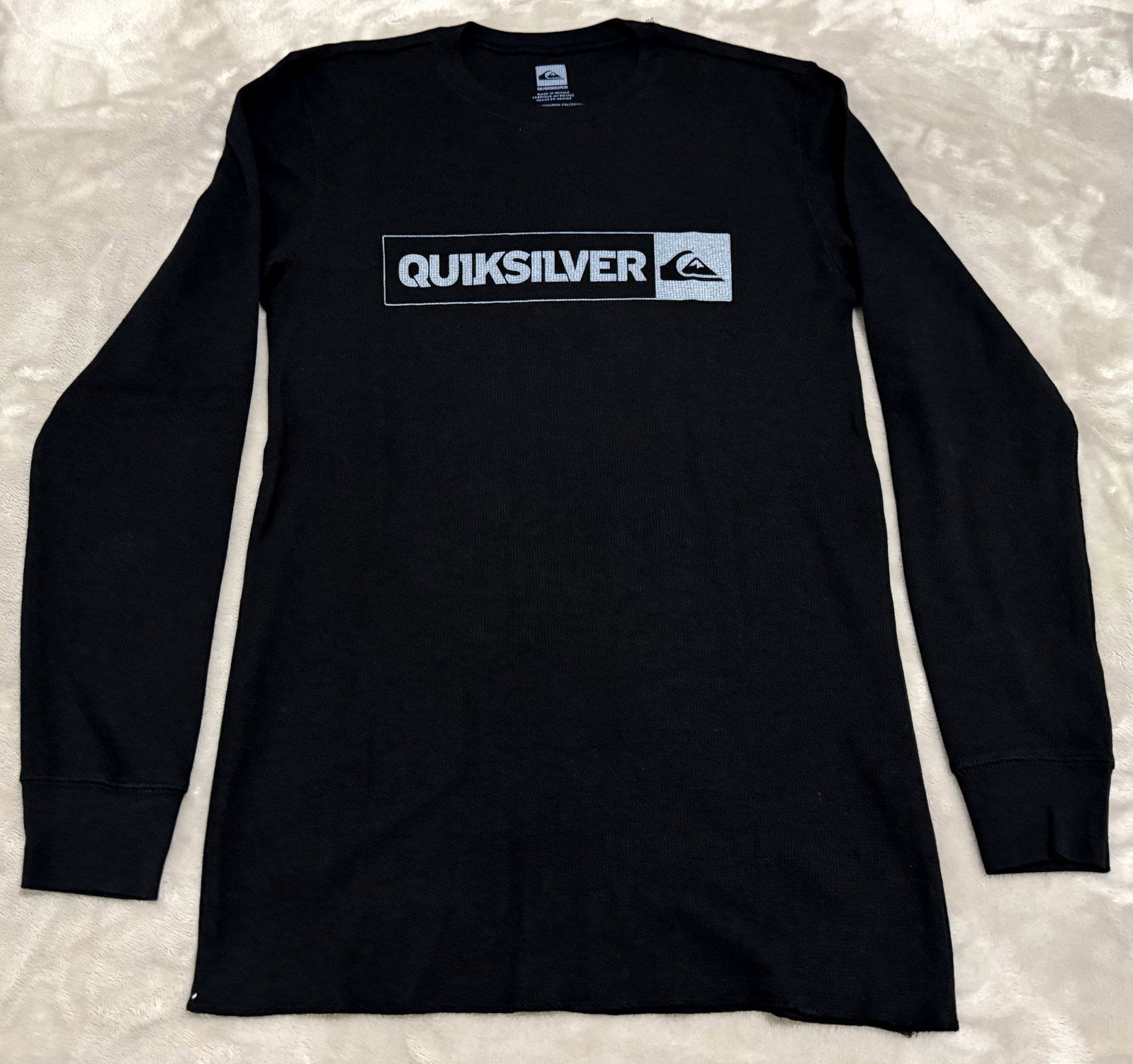 NOS 90s Vintage Quiksilver Waffle Knit Thermal Long Sleeve T-Shirt: Unused Classic skater/surfer lifestyle piece featuring a contrasting white and black rectangular block logo print on the center chest featuring the iconic wave and mountain emblem. Complete with comfy