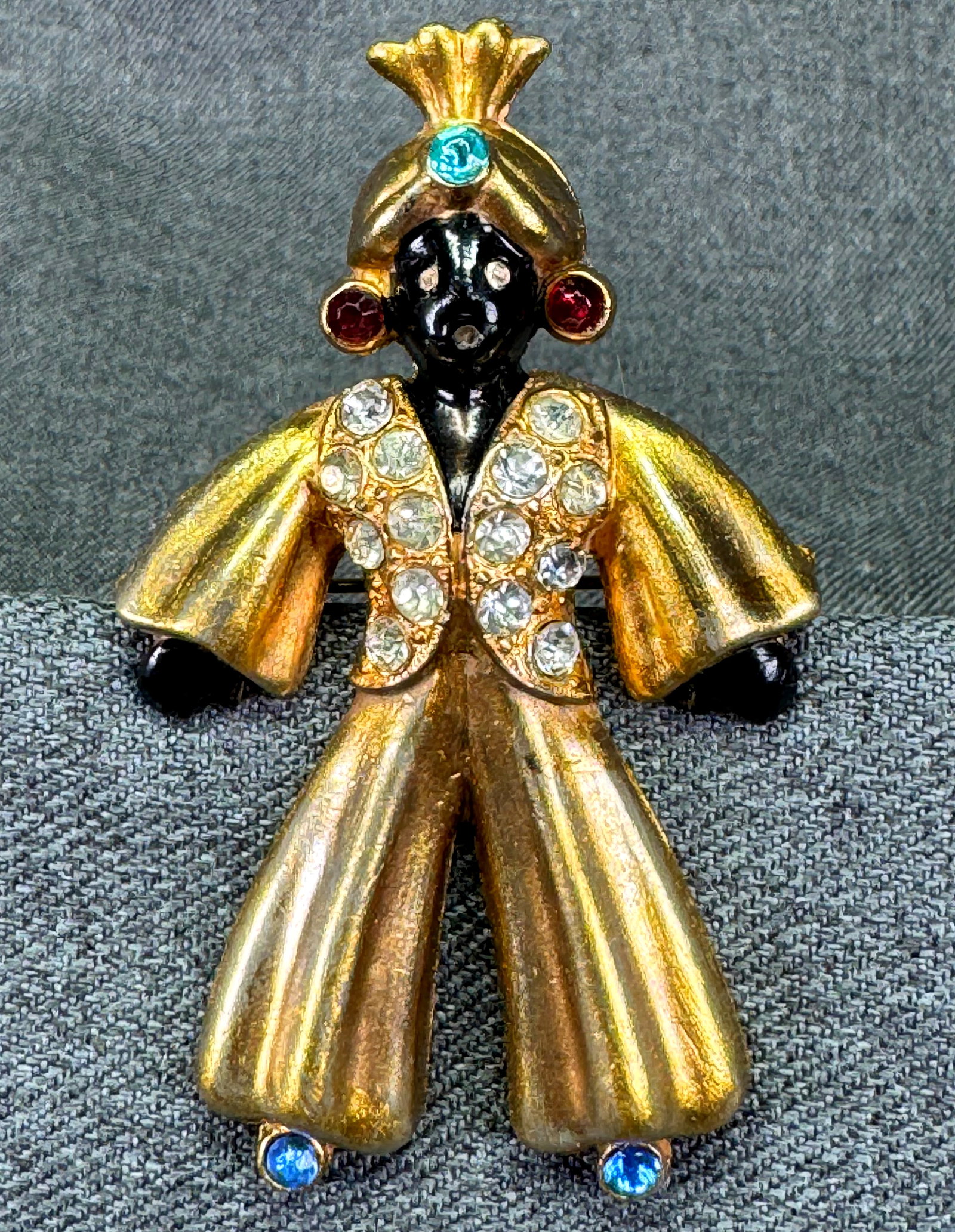 Vintage Fred Gray 1940s Pot Metal Blackamoor Genie Figural Brooch. *p: Vintage 1940s Fred Gray blackamoor genie brooch in gold-washed pot metal. Hand-painted black enamel face, clear pavé rhinestone vest, glass slipper, earrings & turban . Unmarked. For measures please 