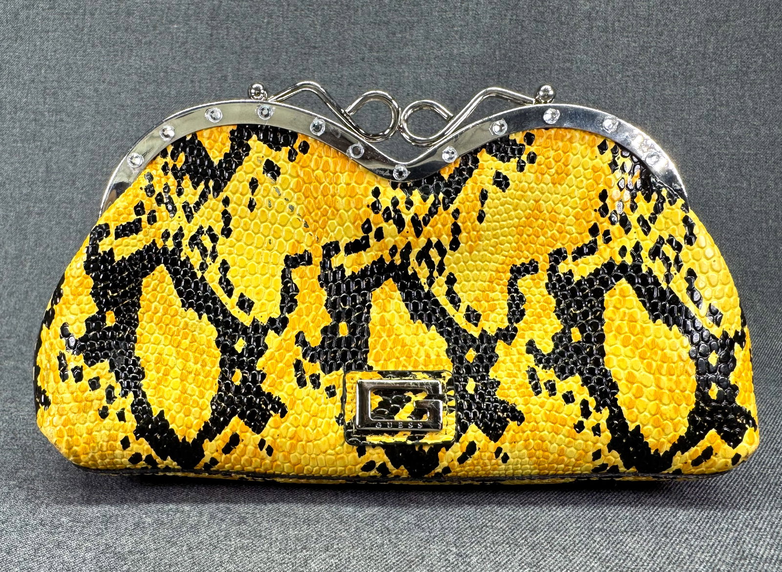 GUESS Vintage Y2K Faux Snakeskin Clutch Bag. *p: GUESS Vintage Y2K Black & Yellow Faux Snakeskin Clutch Bag. For measures please refer to the pictures taken with a measuring tape. Weight: Grams. IN HOUSE FLAT SHIPPING & HANDLING COST WITHIN ALL THE 